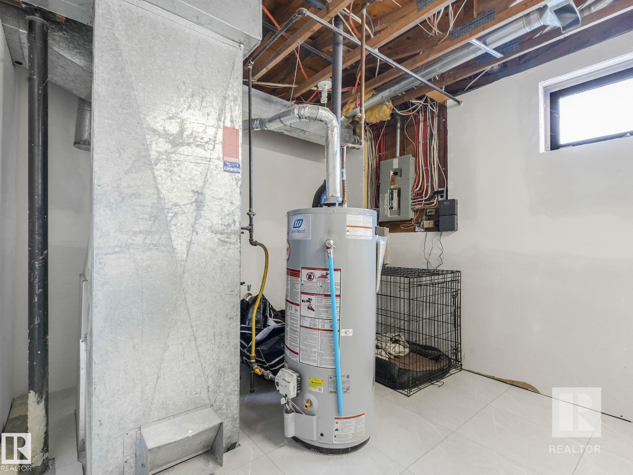 Utilities with water heater and electric panel - 4504 48 Avenue, Onoway, AB - Indoor Photo Showing Basement