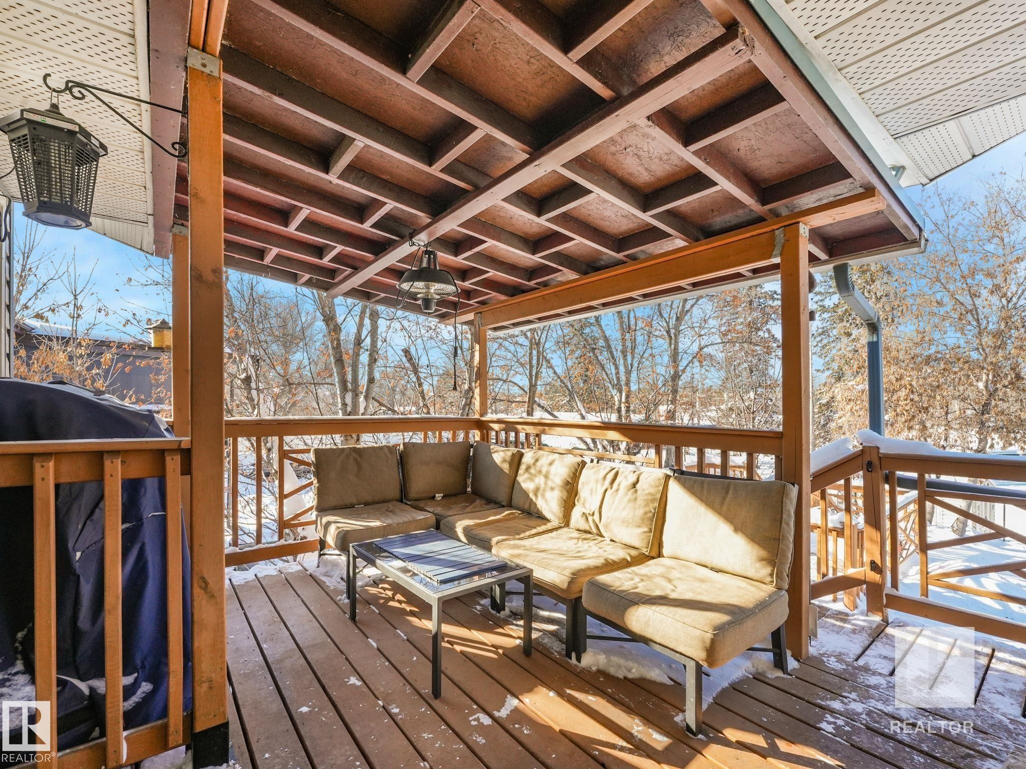 Snow covered deck featuring an outdoor hangout area and area for grilling - 4504 48 Avenue, Onoway, AB - Outdoor With Deck Patio Veranda With Exterior
