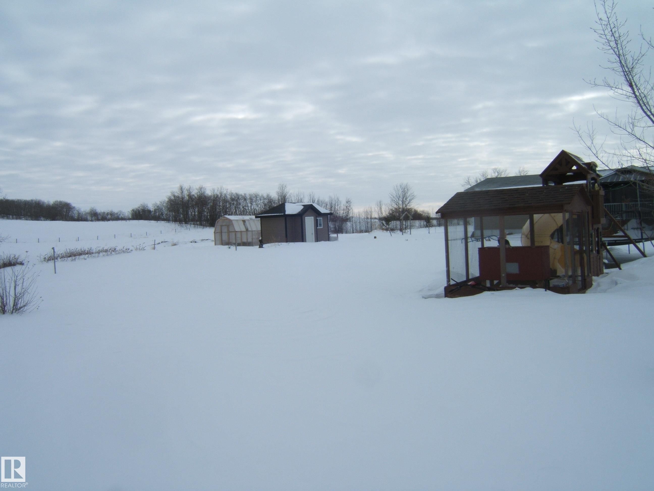 Yard layered in snow with a shed - 125076 Twp Rd 540, Rural Two Hills County, AB - Outdoor