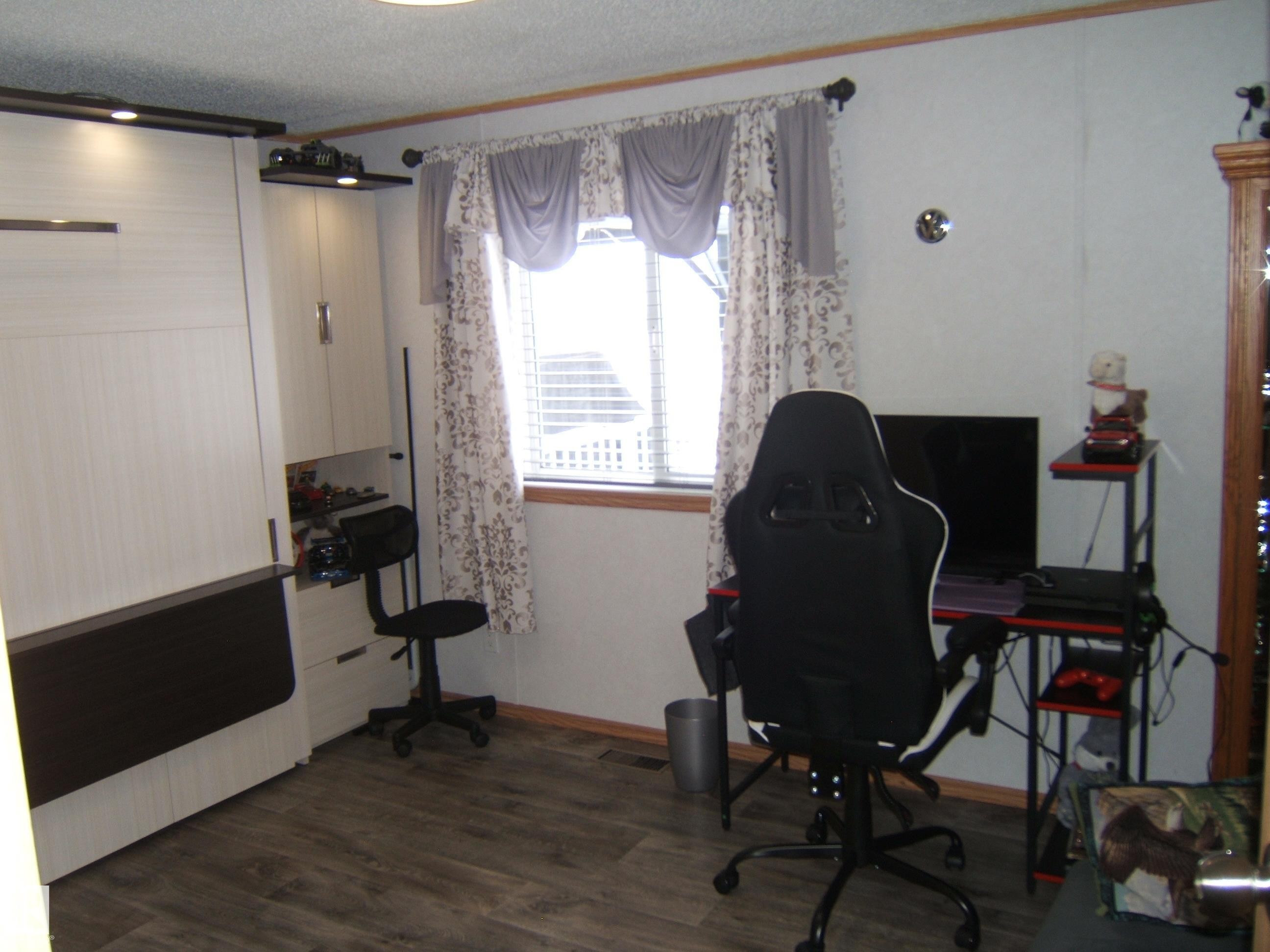 Office featuring ornamental molding, dark wood finished floors, and a textured ceiling - 125076 Twp Rd 540, Rural Two Hills County, AB - Indoor Photo Showing Office