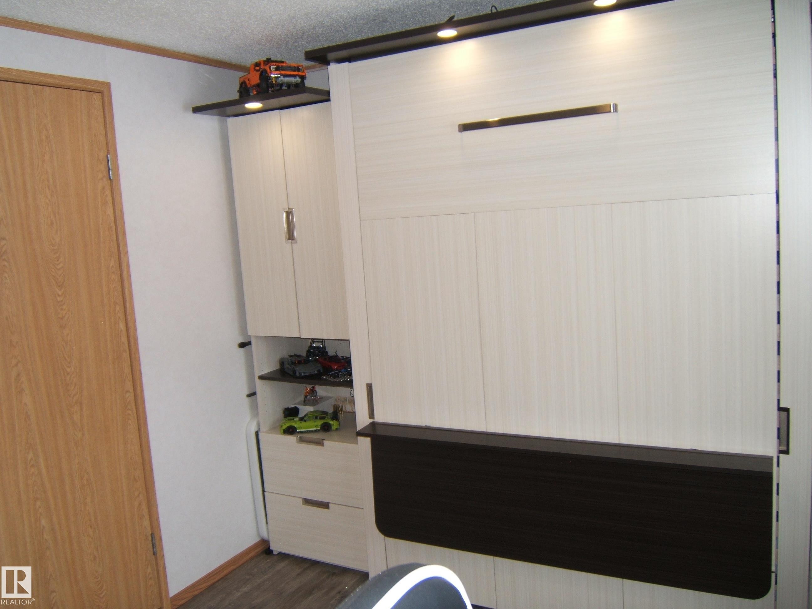 Bathroom with a textured ceiling and dark wood-style floors - 125076 Twp Rd 540, Rural Two Hills County, AB - Indoor