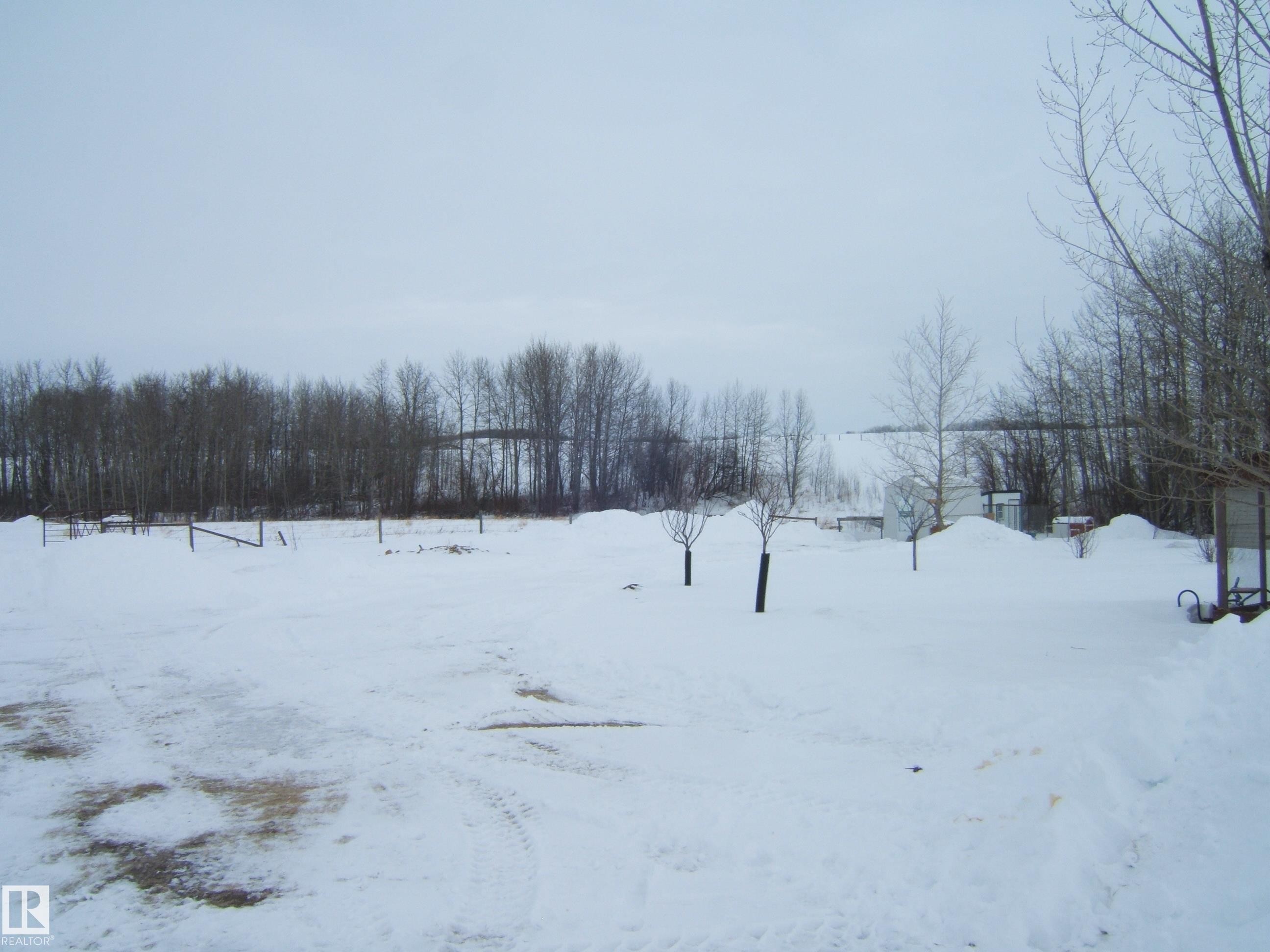 View of yard covered in snow - 125076 Twp Rd 540, Rural Two Hills County, AB - Outdoor With View