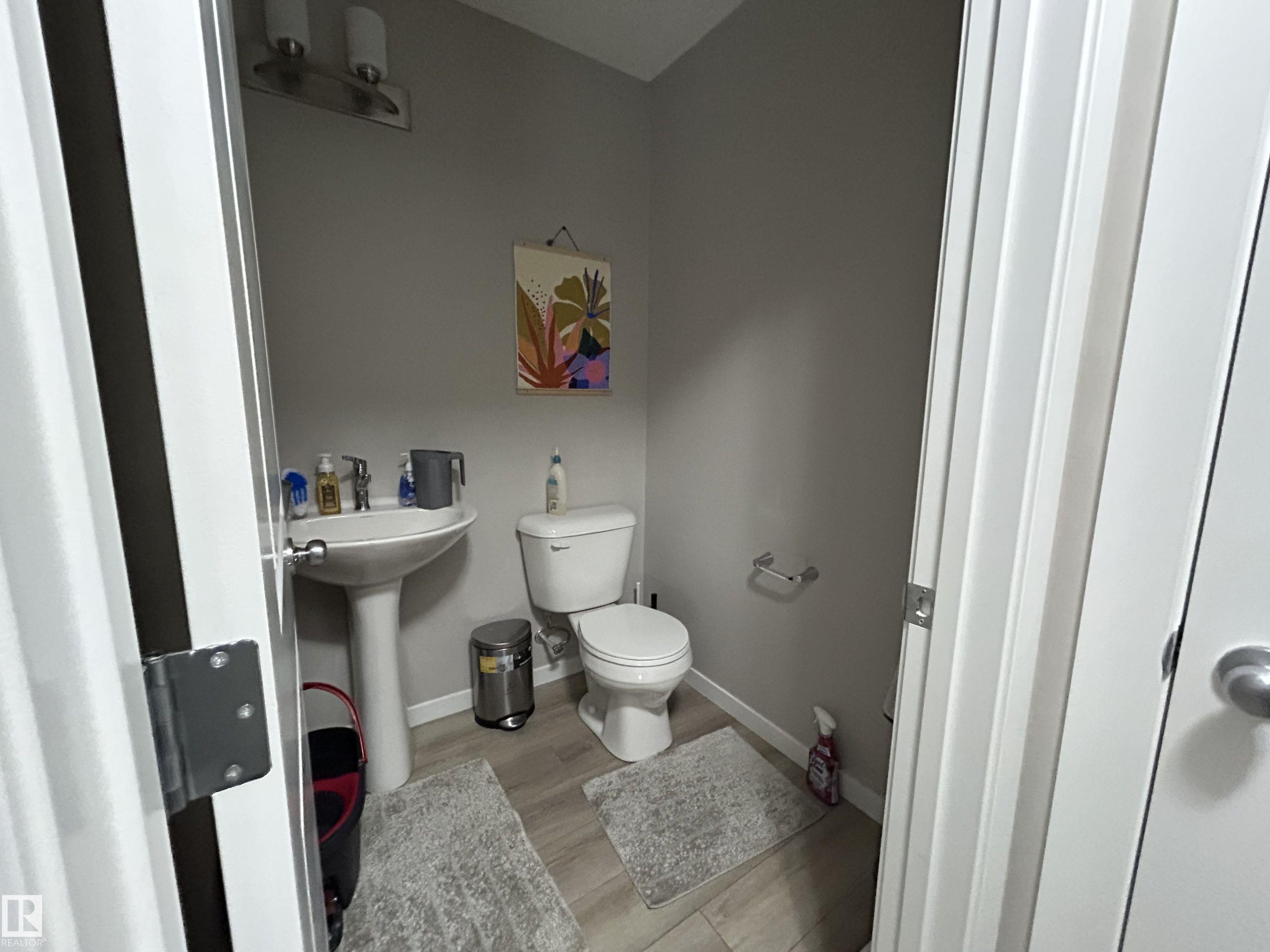 Bathroom featuring toilet and light wood-style flooring - 120 1530 Tamarack Boulevard, Edmonton, AB - Indoor Photo Showing Bathroom