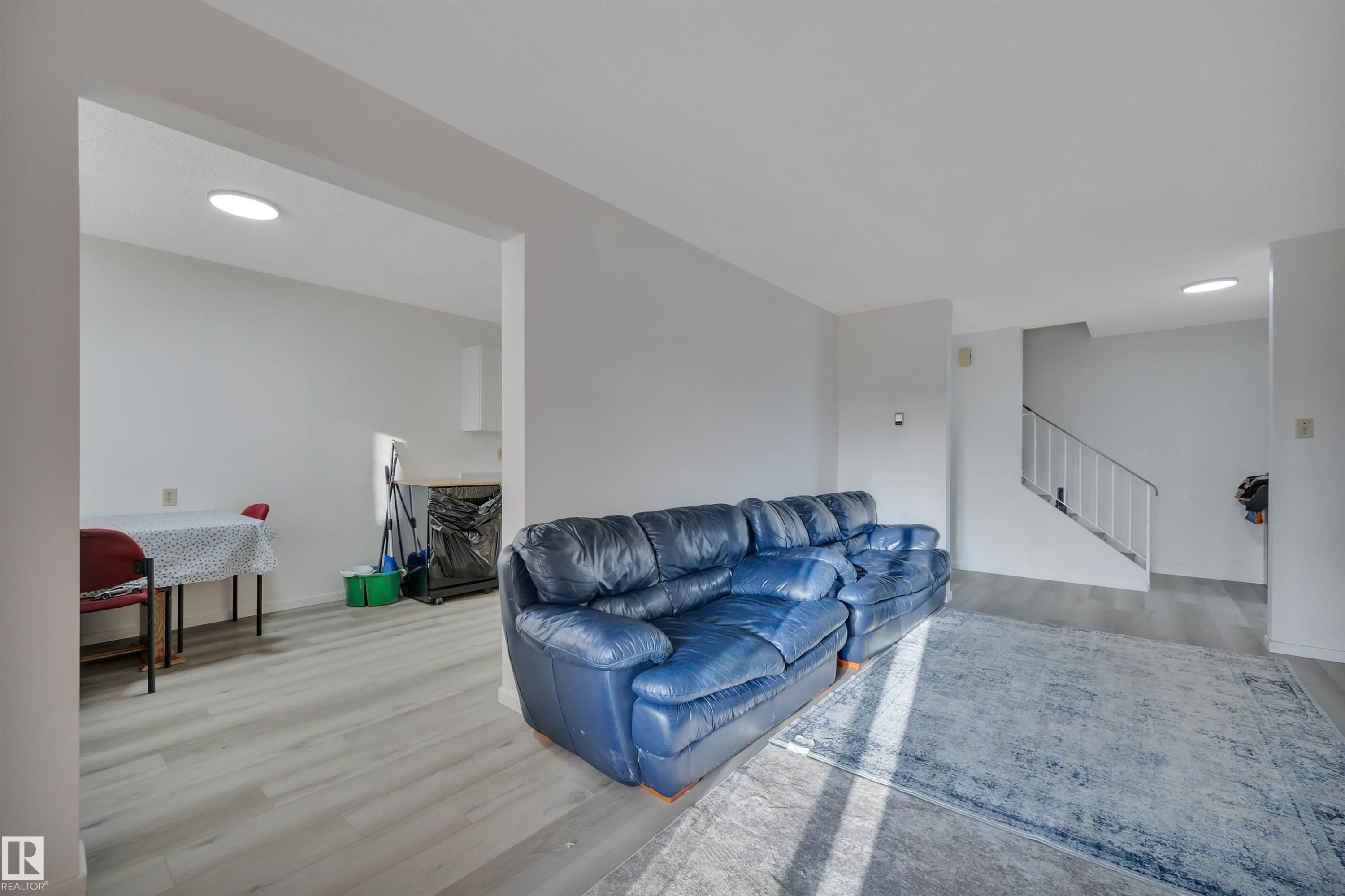 8216-8222 120 Avenue, Edmonton, AB - Indoor Photo Showing Living Room