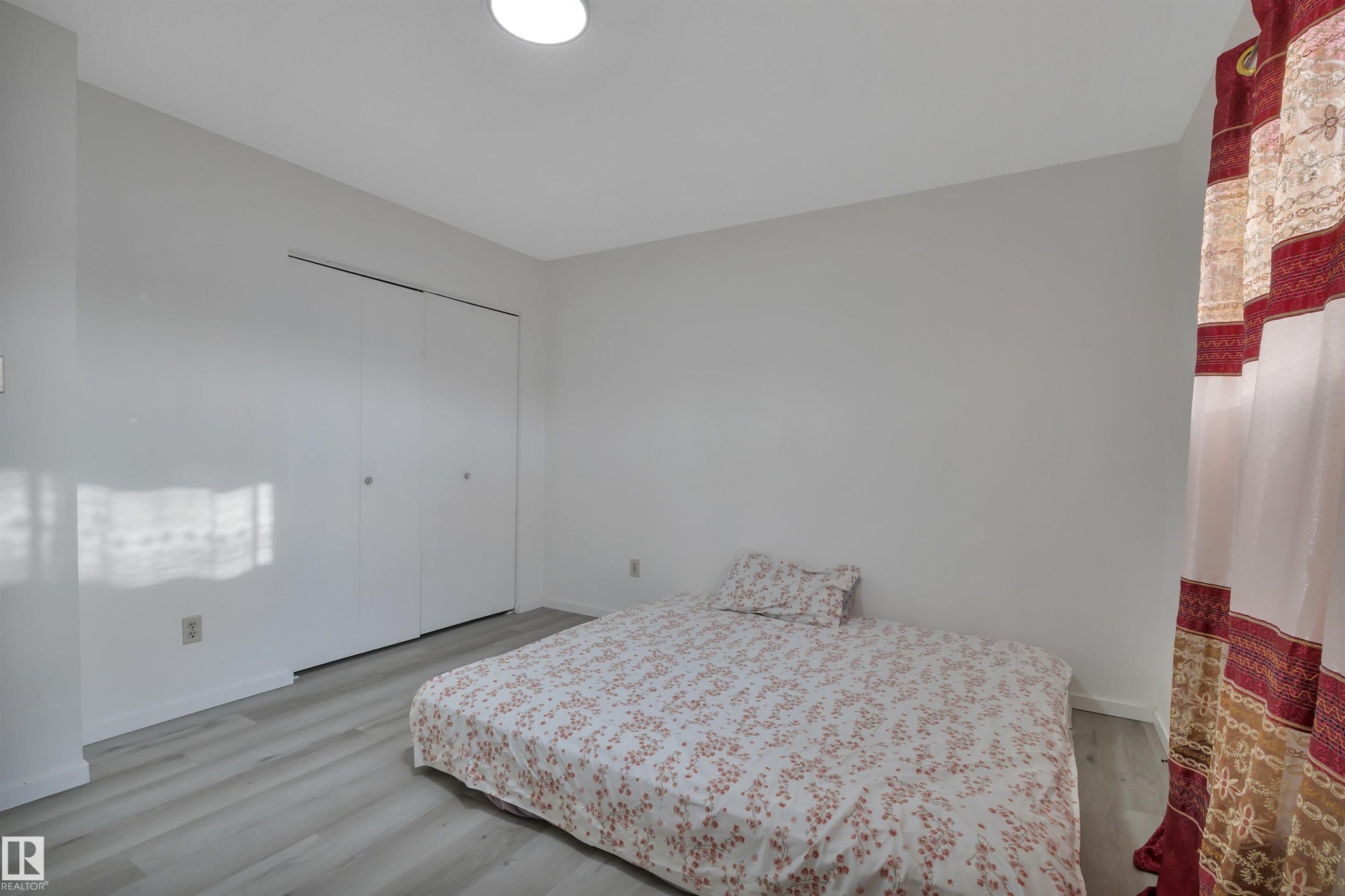 8216-8222 120 Avenue, Edmonton, AB - Indoor Photo Showing Bedroom