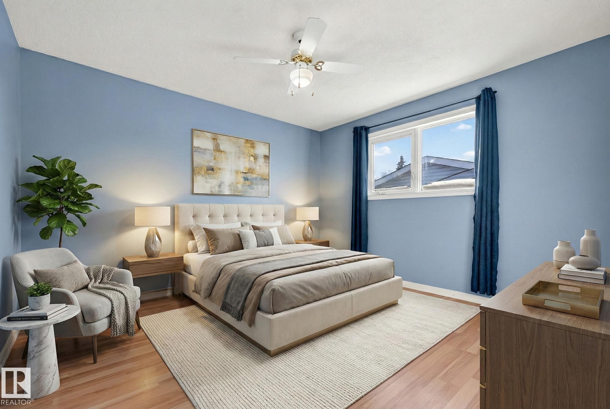 Bedroom with wood finished floors and ceiling fan - 4645 115 Avenue, Edmonton, AB - Indoor Photo Showing Bedroom
