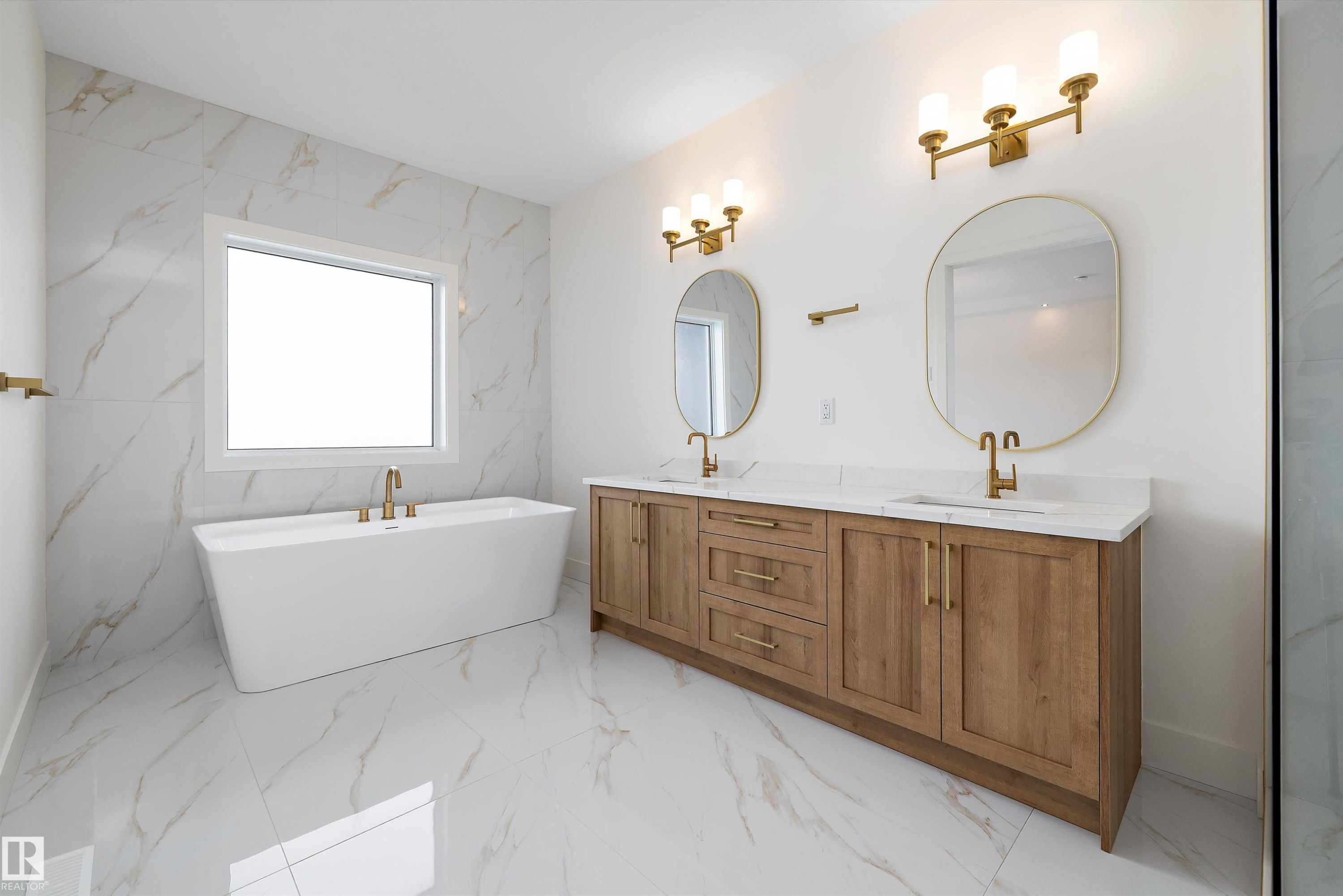 Full bath with light marble finish flooring, double vanity, and a soaking tub - 6871 Knox Loop Sw, Edmonton, AB - Indoor Photo Showing Bathroom