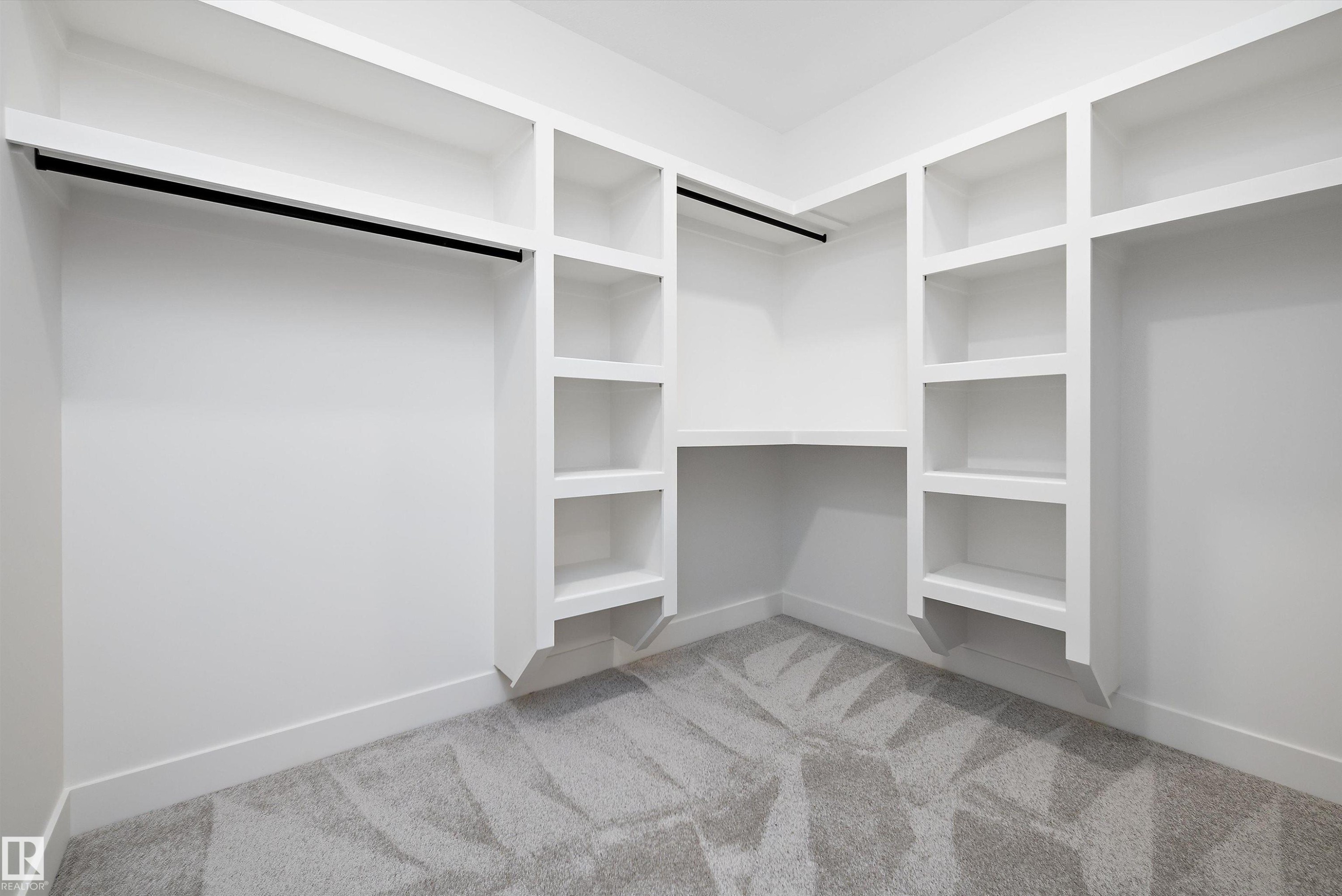 Walk in closet with light carpet - 6871 Knox Loop Sw, Edmonton, AB - Indoor With Storage