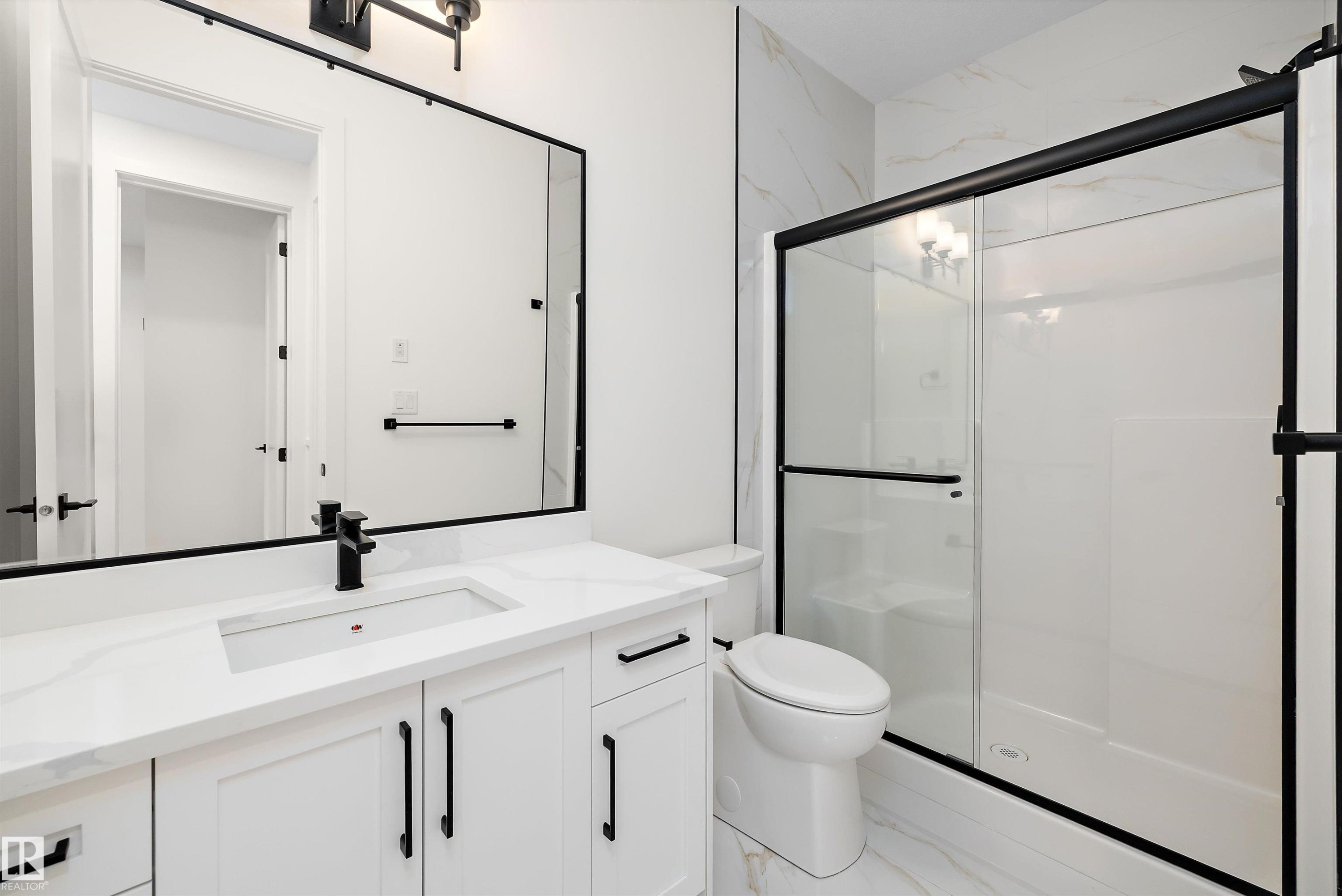Full bath featuring vanity, a stall shower, and light marble finish floors - 6871 Knox Loop Sw, Edmonton, AB - Indoor Photo Showing Bathroom