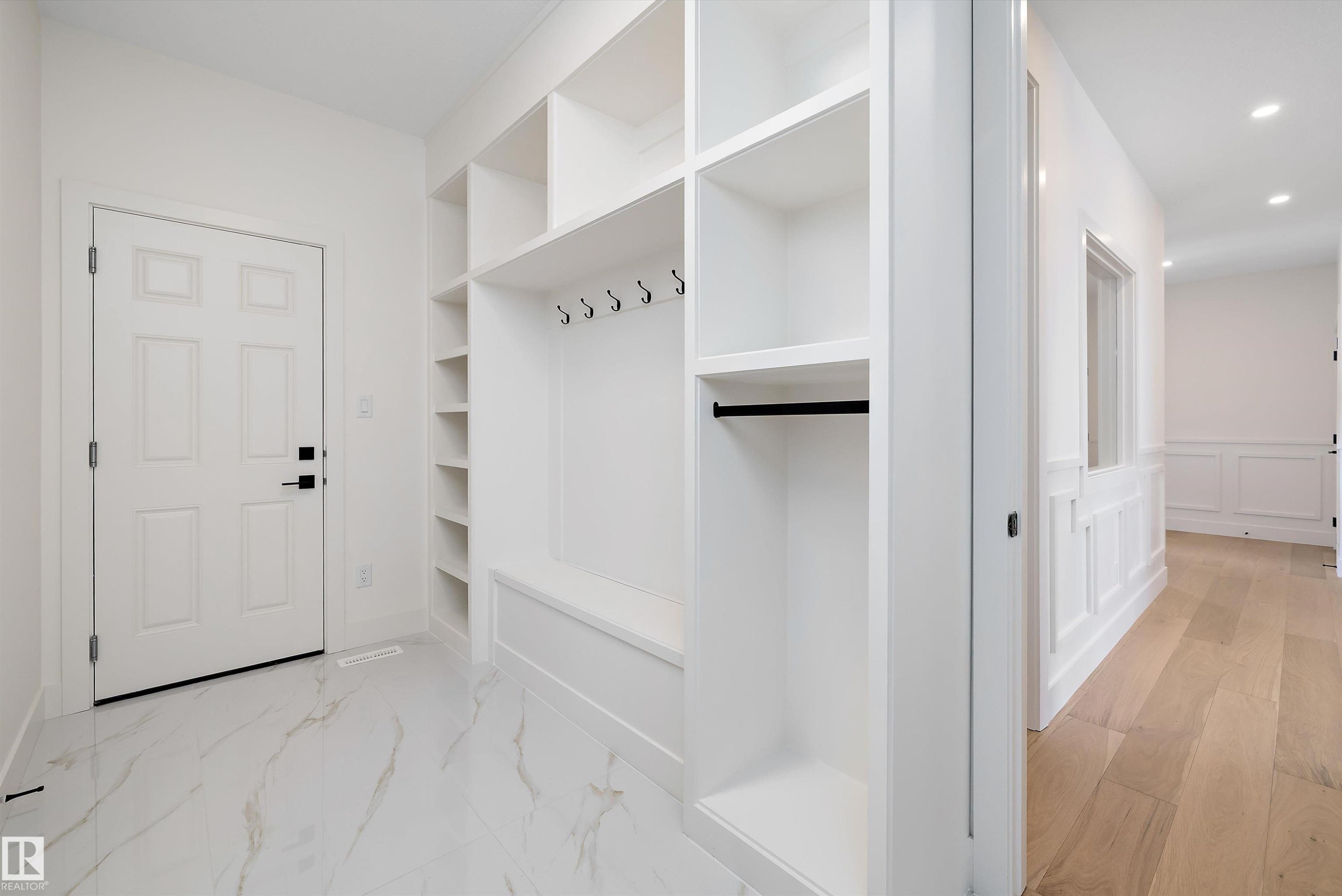 Mudroom featuring recessed lighting, a decorative wall, and a wainscoted wall - 6871 Knox Loop Sw, Edmonton, AB - Indoor