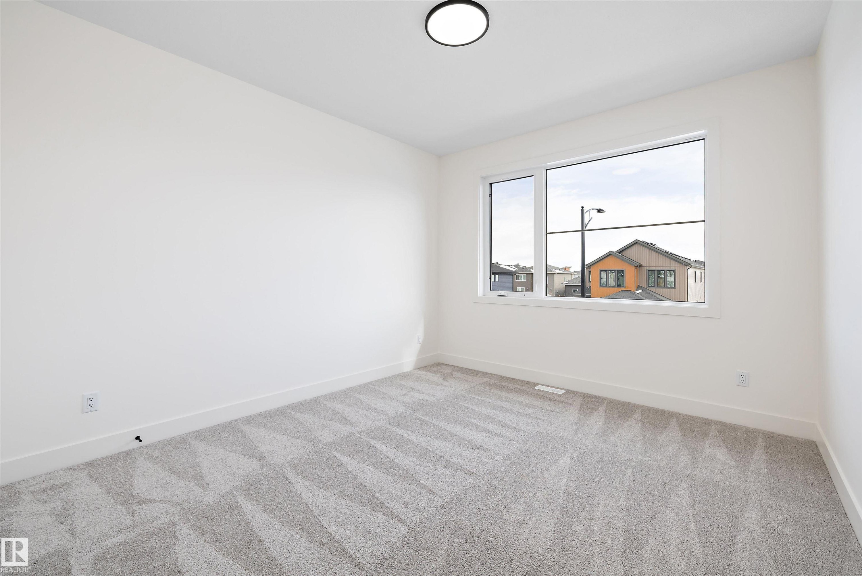 Unfurnished room with baseboards and light colored carpet - 6871 Knox Loop Sw, Edmonton, AB - Indoor Photo Showing Other Room