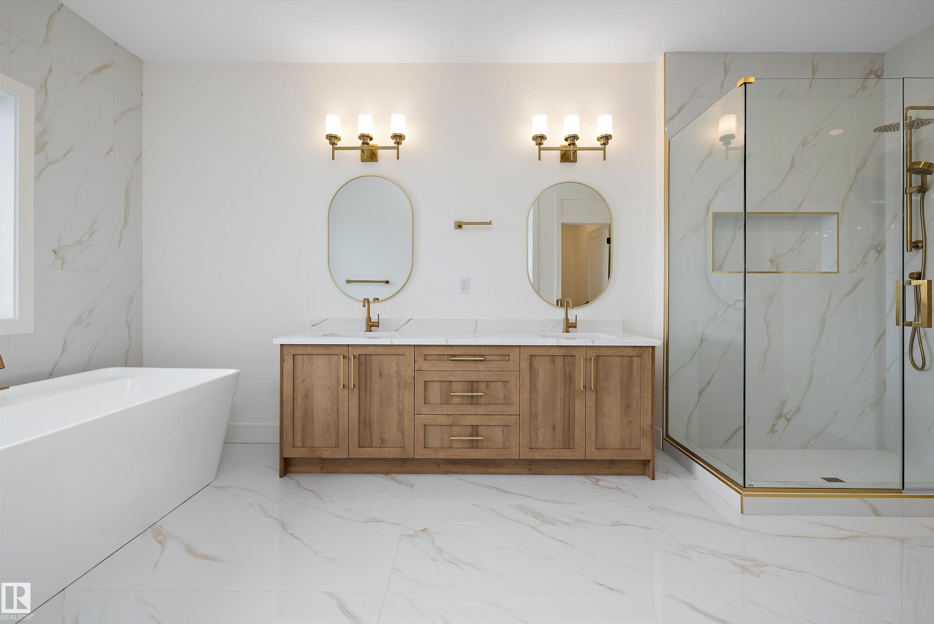 Full bath with light marble finish floors, double vanity, a marble finish shower, and a freestanding bath - 6871 Knox Loop Sw, Edmonton, AB - Indoor Photo Showing Bathroom