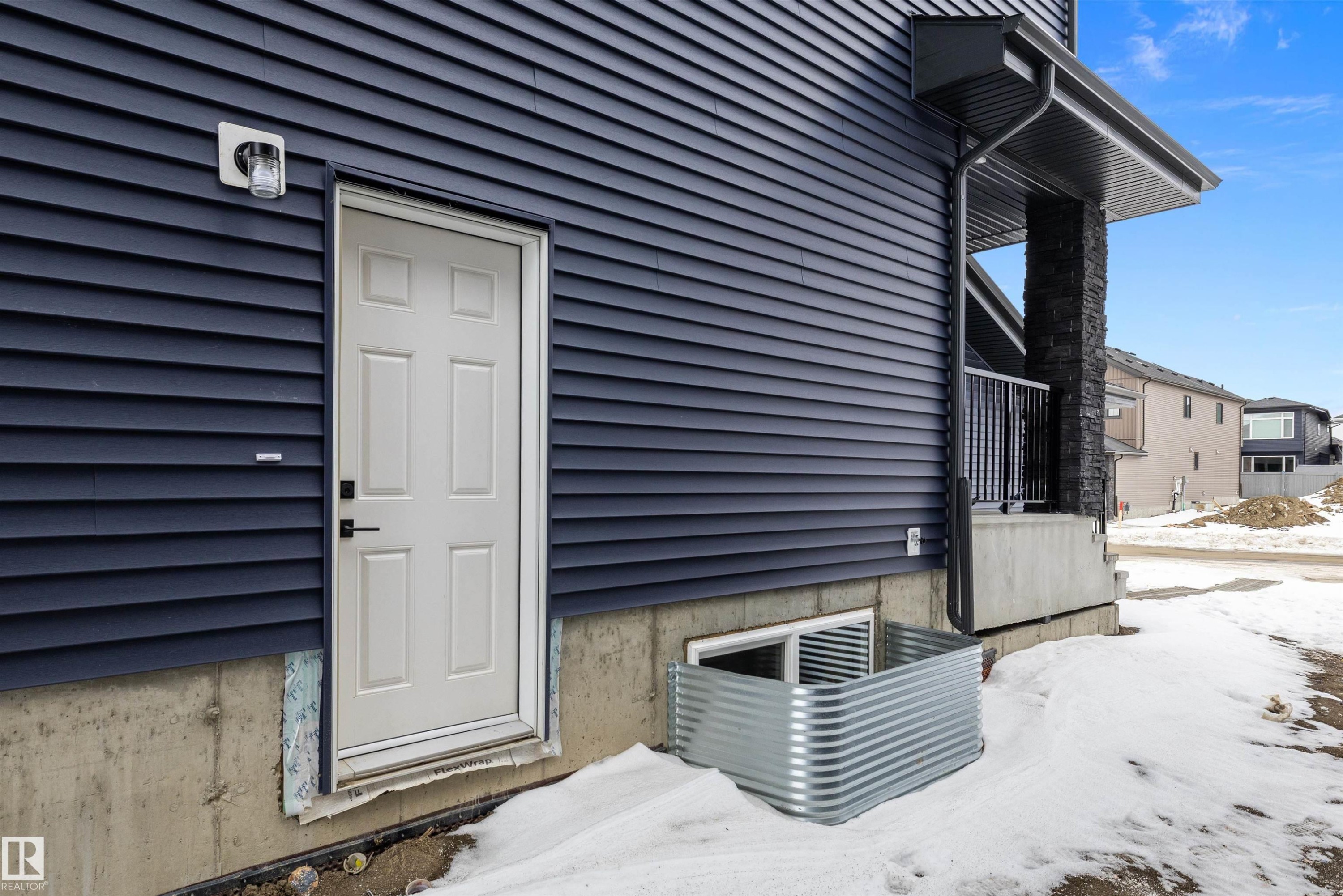 View of snow covered property entrance - 6871 Knox Loop Sw, Edmonton, AB - Outdoor With Exterior