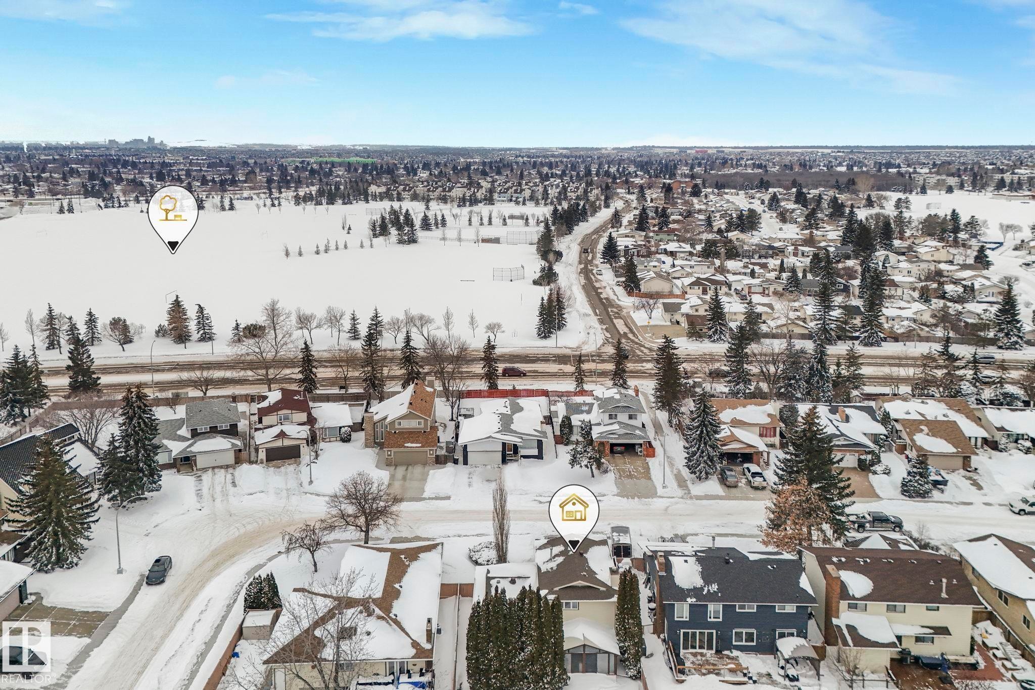 Snowy aerial view featuring a residential view - 15909 112 B Street Nw, Edmonton, AB - Outdoor With View