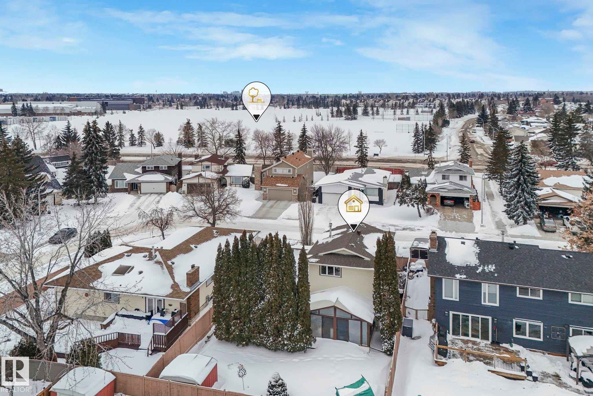Snowy aerial view featuring a residential view - 15909 112 B Street Nw, Edmonton, AB - Outdoor With View