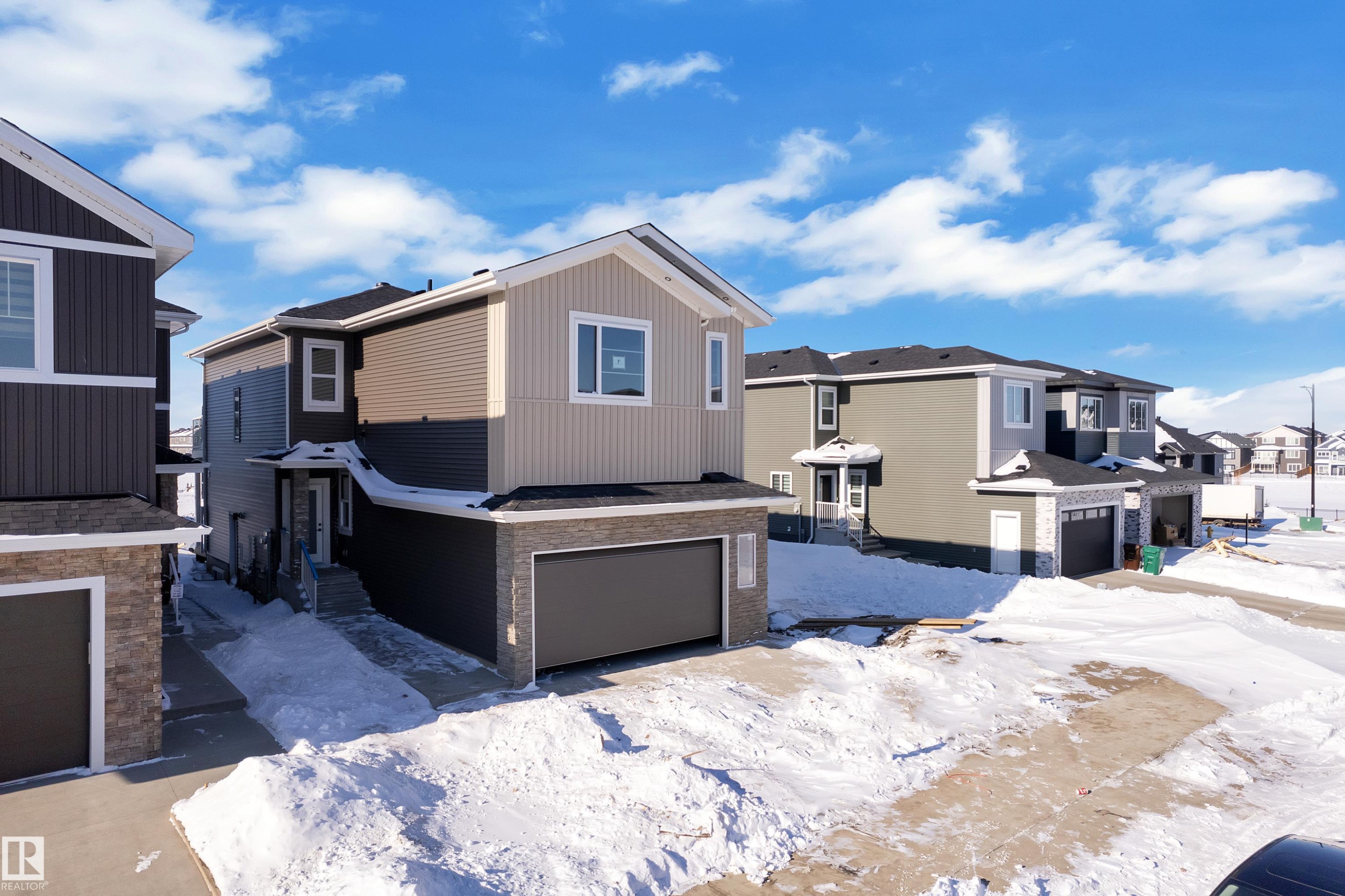 View of front of home with a residential view and an attached garage - 95 Eldridge Point(E), St. Albert, AB - Outdoor