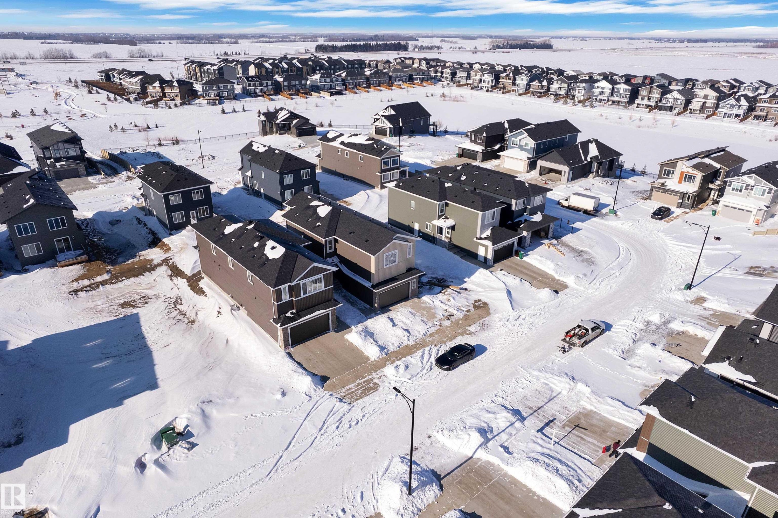 Snowy aerial view with a residential view - 95 Eldridge Point(E), St. Albert, AB - Outdoor With View