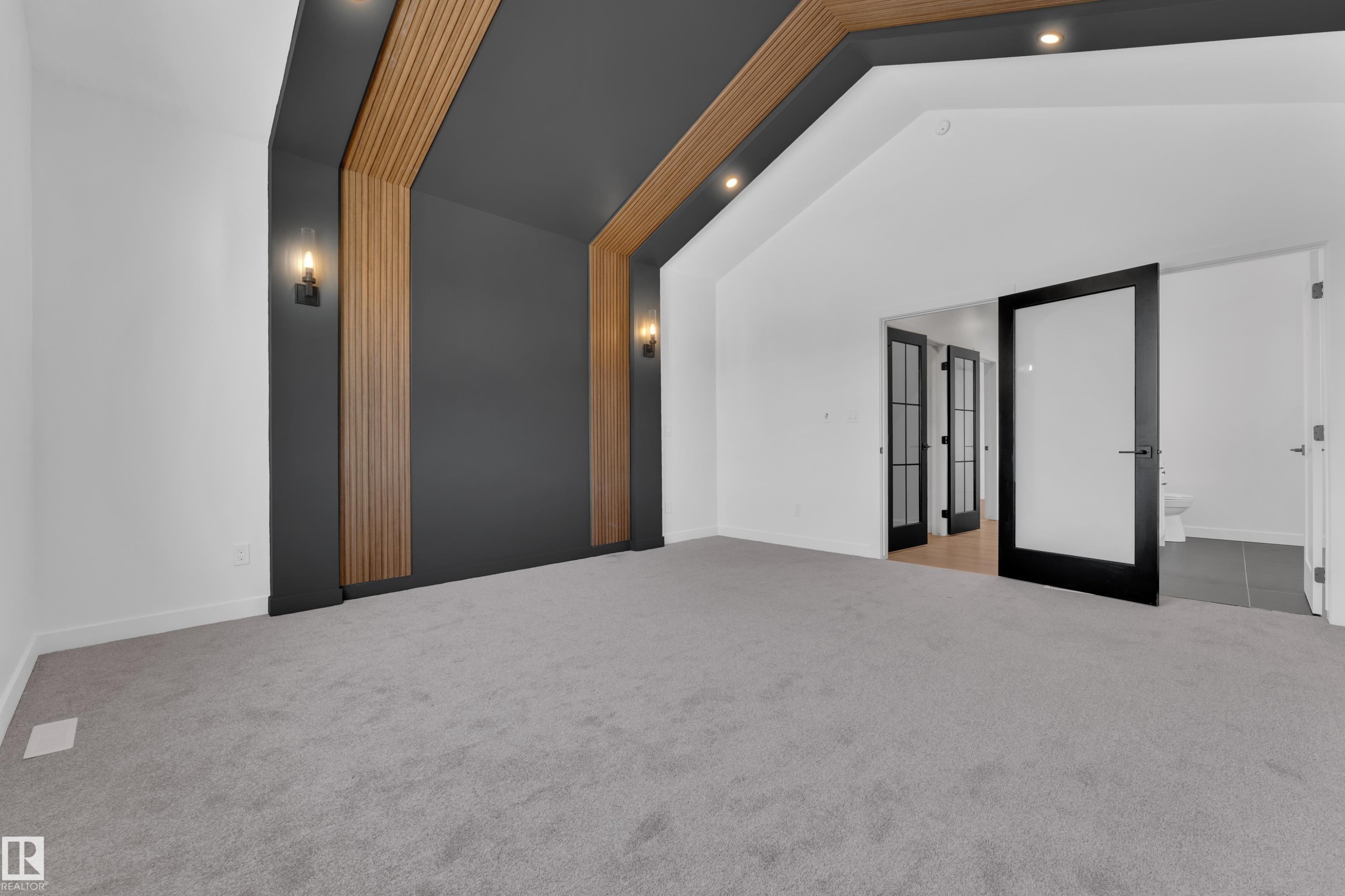 Carpeted spare room with vaulted ceiling, french doors, and recessed lighting - 95 Eldridge Point(E), St. Albert, AB - Indoor Photo Showing Other Room
