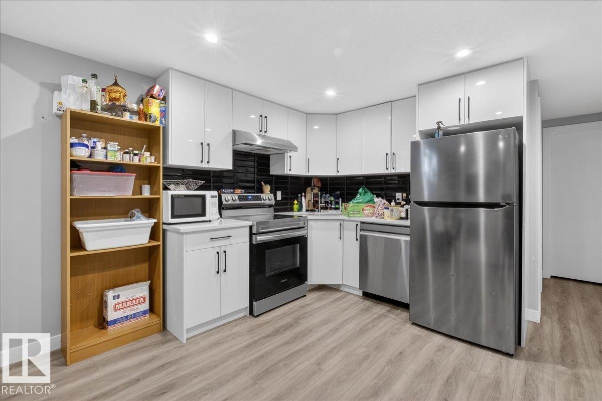Living area featuring recessed lighting and wood finished floors - 1027 150 Avenue, Edmonton, AB - Indoor Photo Showing Kitchen