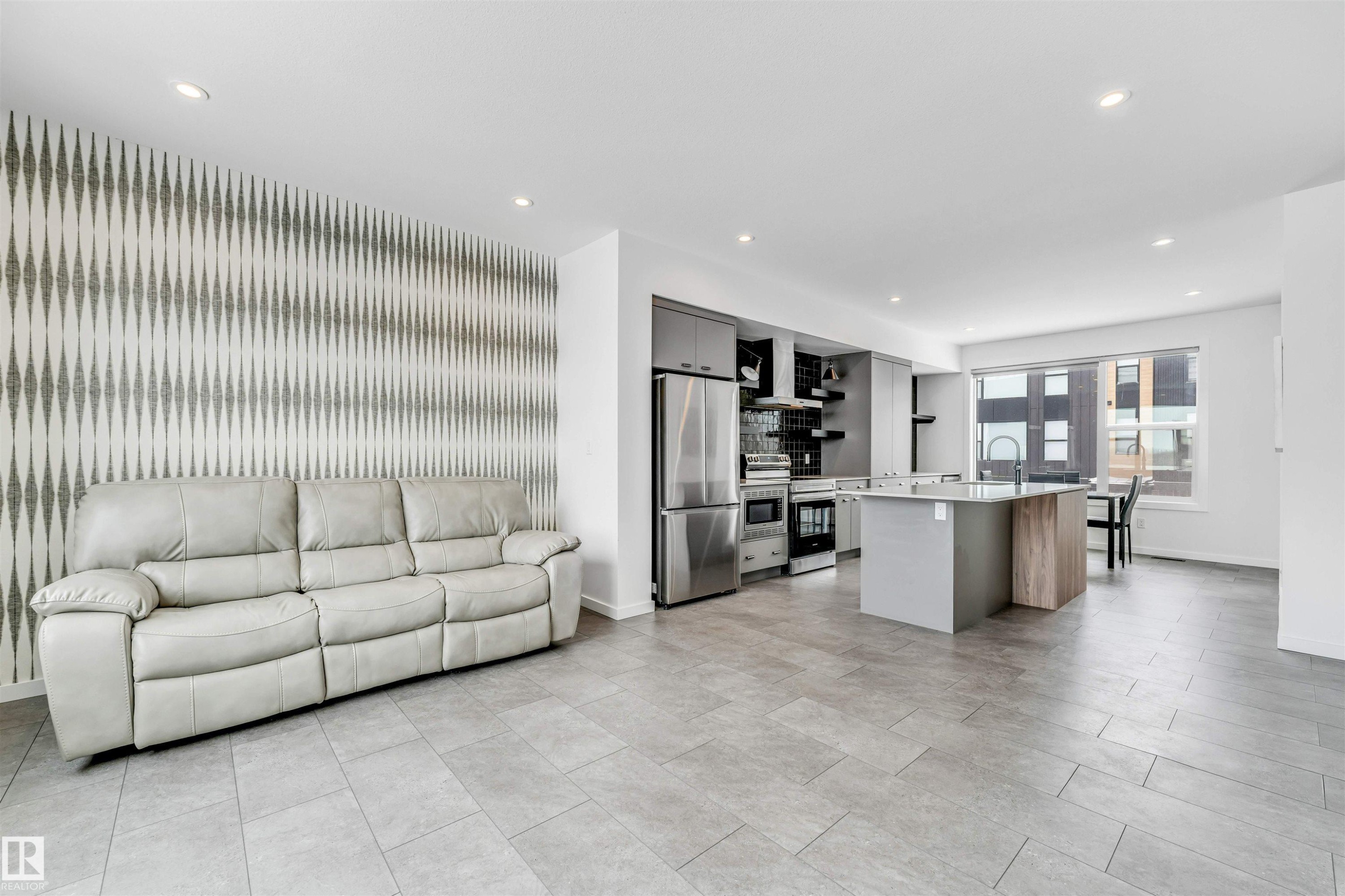 Living room with recessed lighting and an accent wall - 77 5 Rondeau Drive, St. Albert, AB - Indoor