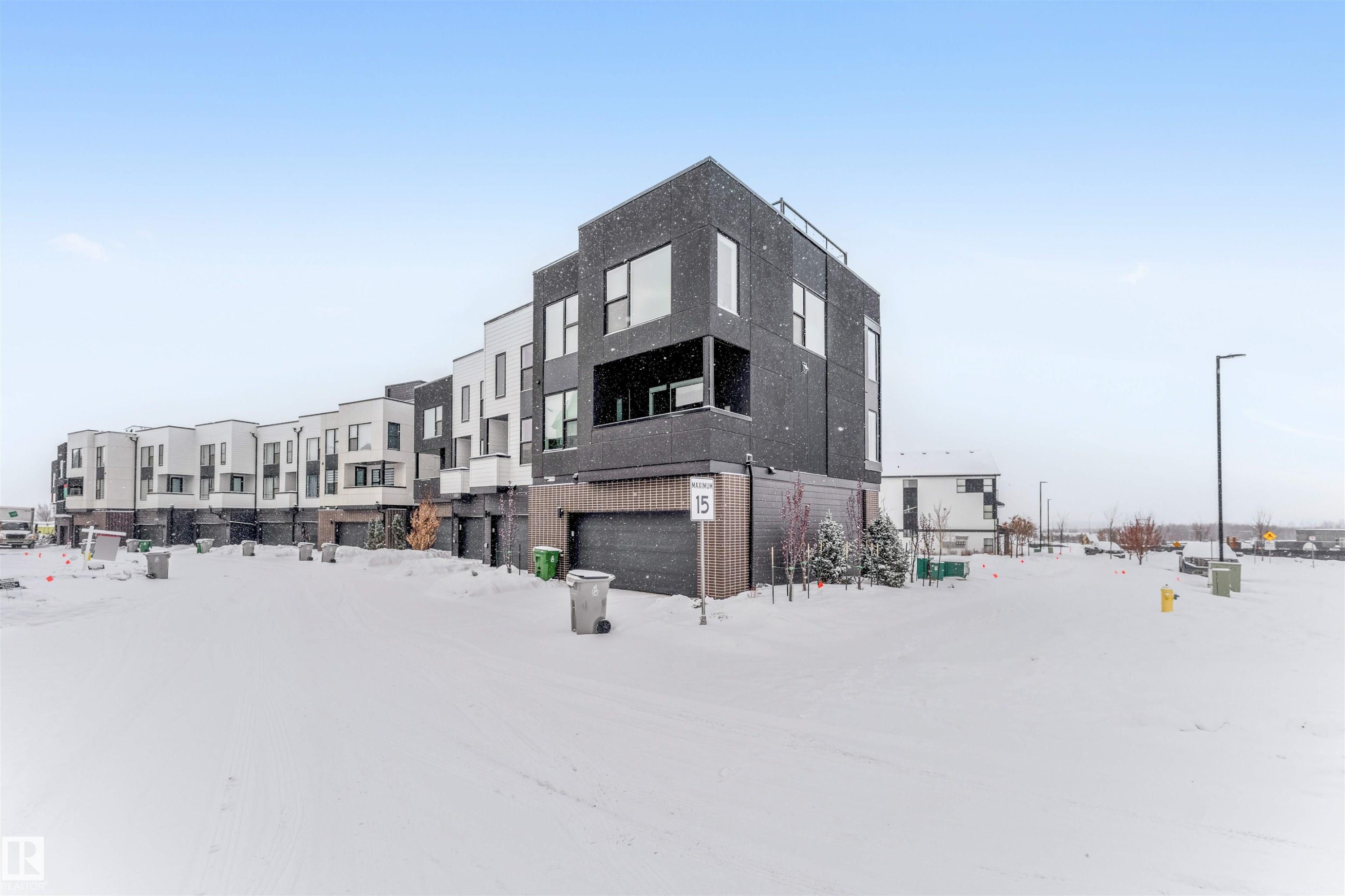 Snow covered building with a residential view - 77 5 Rondeau Drive, St. Albert, AB - Outdoor