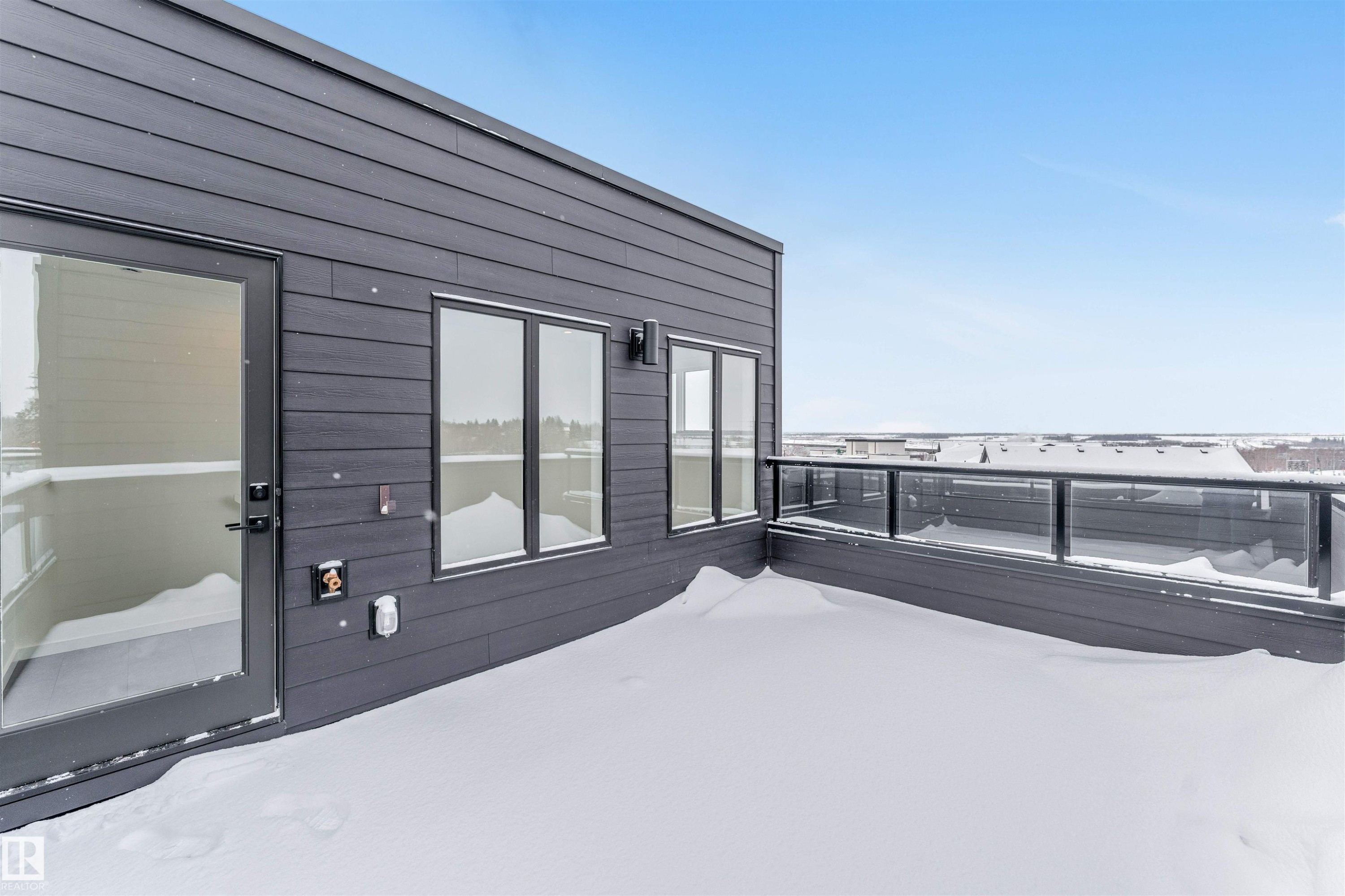 Snow covered deck with a patio - 77 5 Rondeau Drive, St. Albert, AB - Outdoor With Exterior