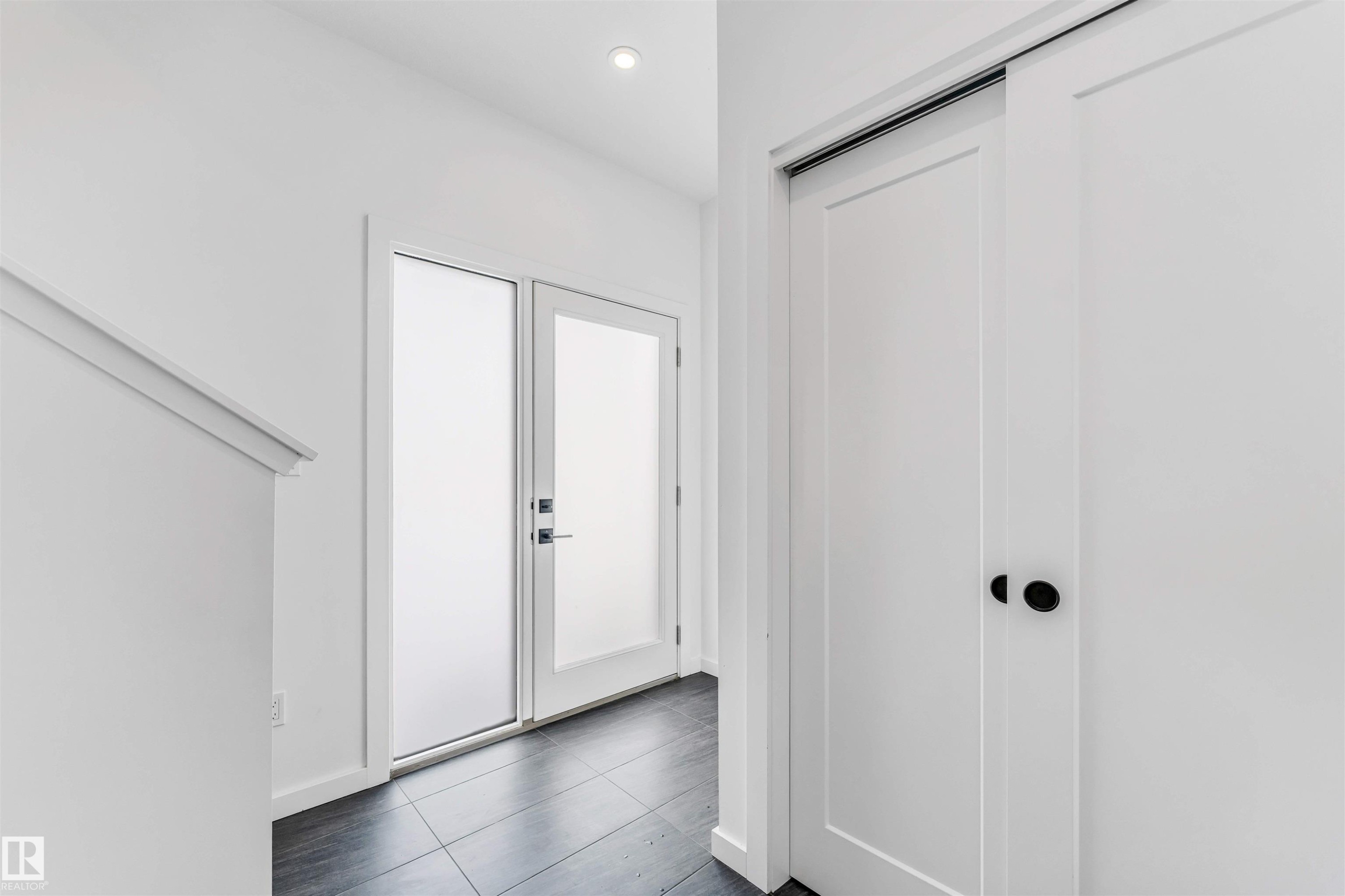Entryway with recessed lighting and dark tile patterned flooring - 77 5 Rondeau Drive, St. Albert, AB - Indoor Photo Showing Other Room