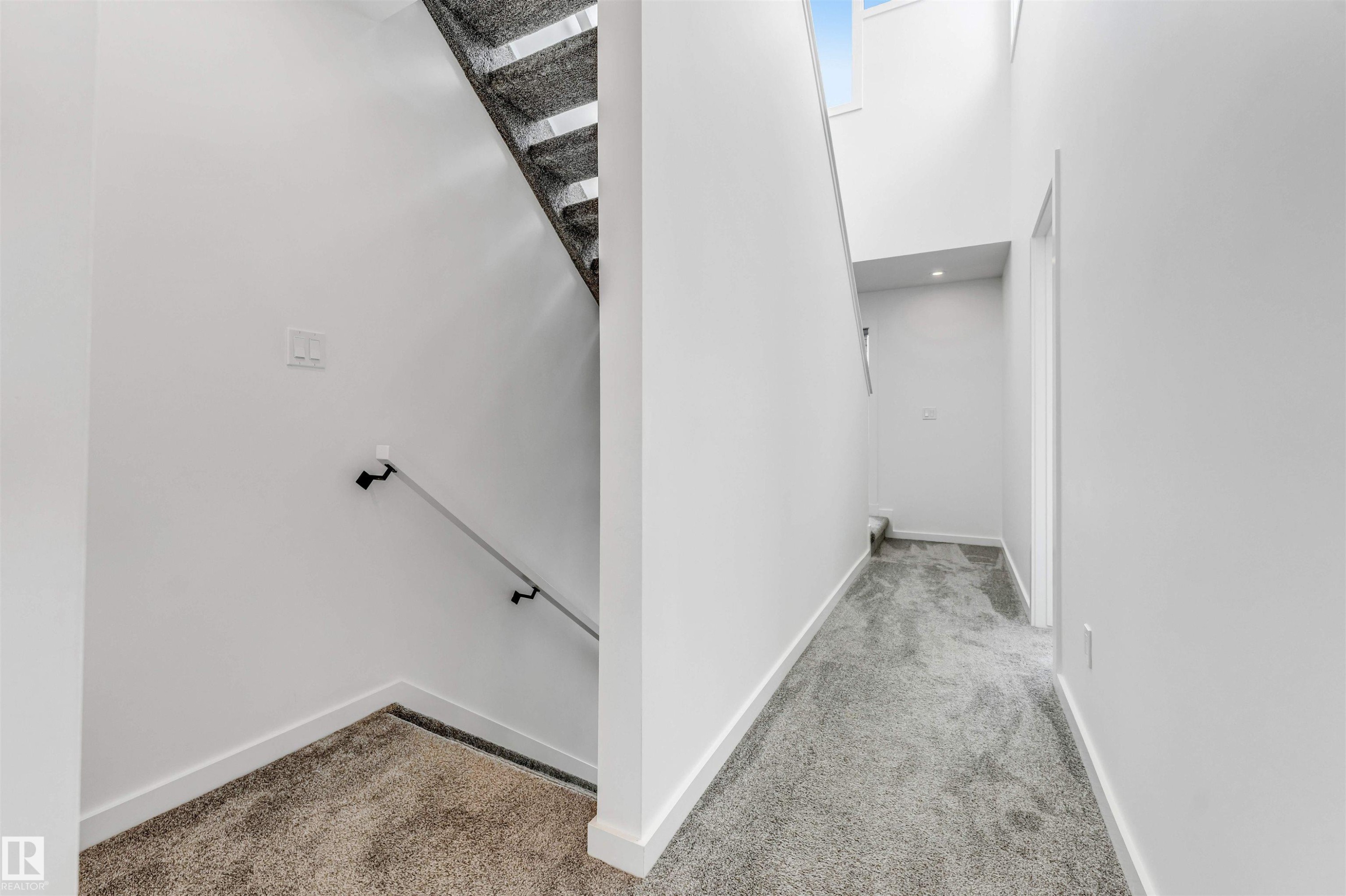 Stairs with carpet floors and a high ceiling - 77 5 Rondeau Drive, St. Albert, AB - Indoor Photo Showing Other Room