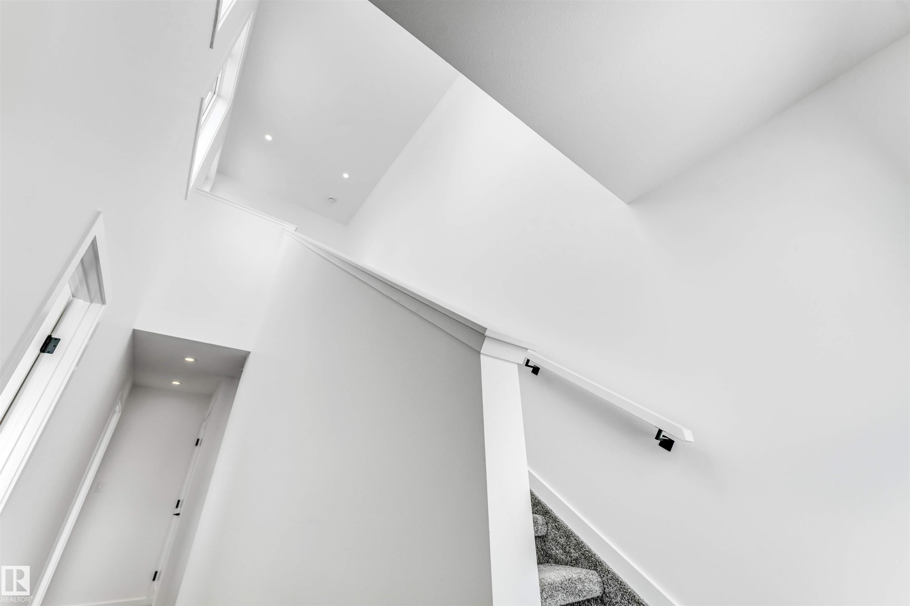 Stairway featuring recessed lighting and carpet flooring - 77 5 Rondeau Drive, St. Albert, AB - Indoor Photo Showing Other Room