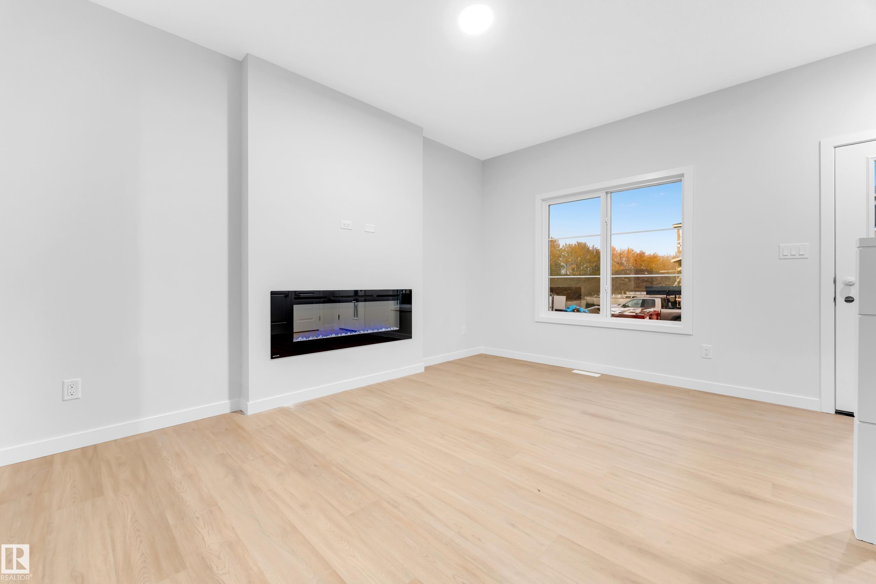 252 24 Street Sw, Edmonton, AB - Indoor Photo Showing Living Room With Fireplace