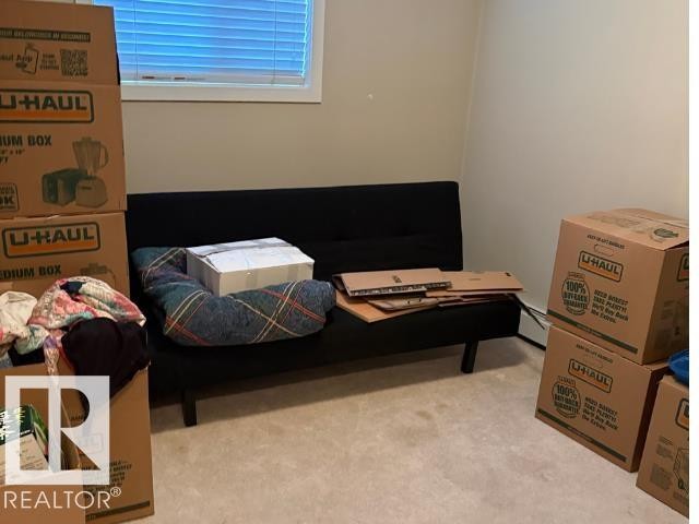 Bedroom featuring light carpet - 118 396 Silverberry Road Nw, Edmonton, AB - Indoor