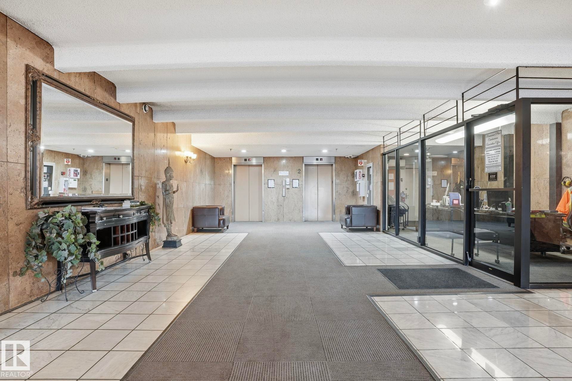 Building lobby with recessed lighting and beamed ceiling - 1103 9918 101 Street, Edmonton, AB - Indoor Photo Showing Other Room