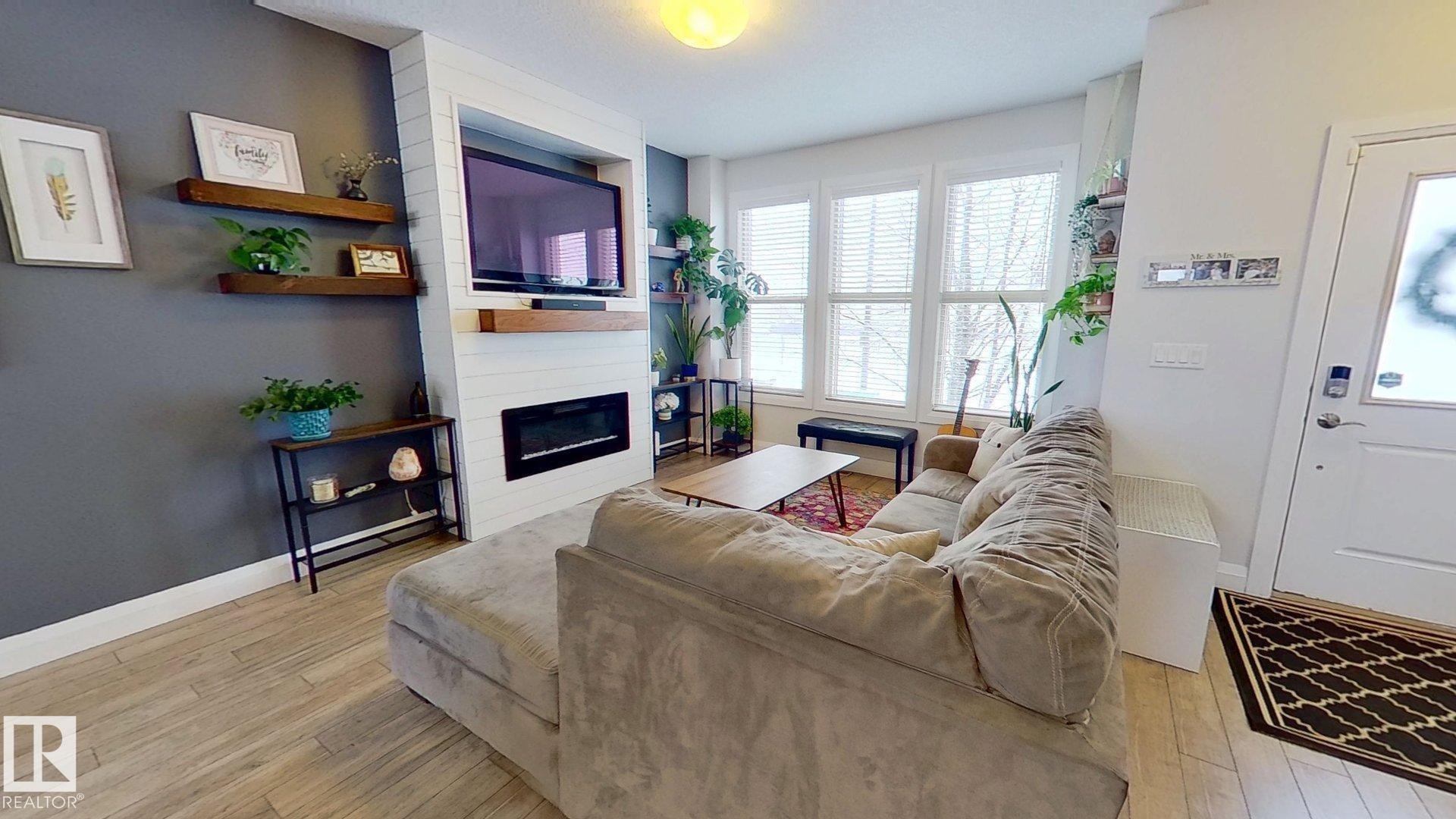 321 Pioneer Road, Spruce Grove, AB - Indoor Photo Showing Living Room With Fireplace