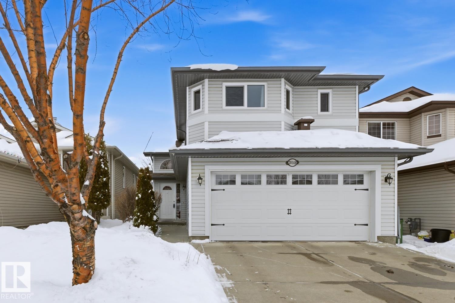 Traditional-style home featuring driveway and a garage - 20148 46 Avenue, Edmonton, AB - Outdoor With Facade