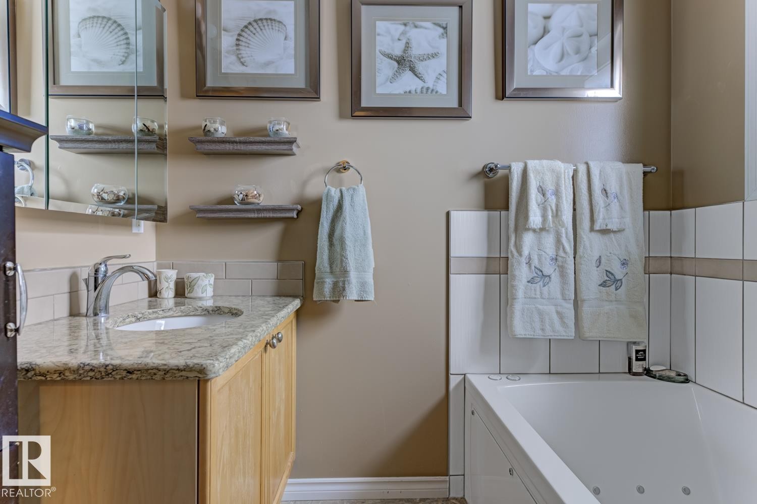 Bathroom featuring vanity and a jetted tub - 20148 46 Avenue, Edmonton, AB - Indoor Photo Showing Bathroom