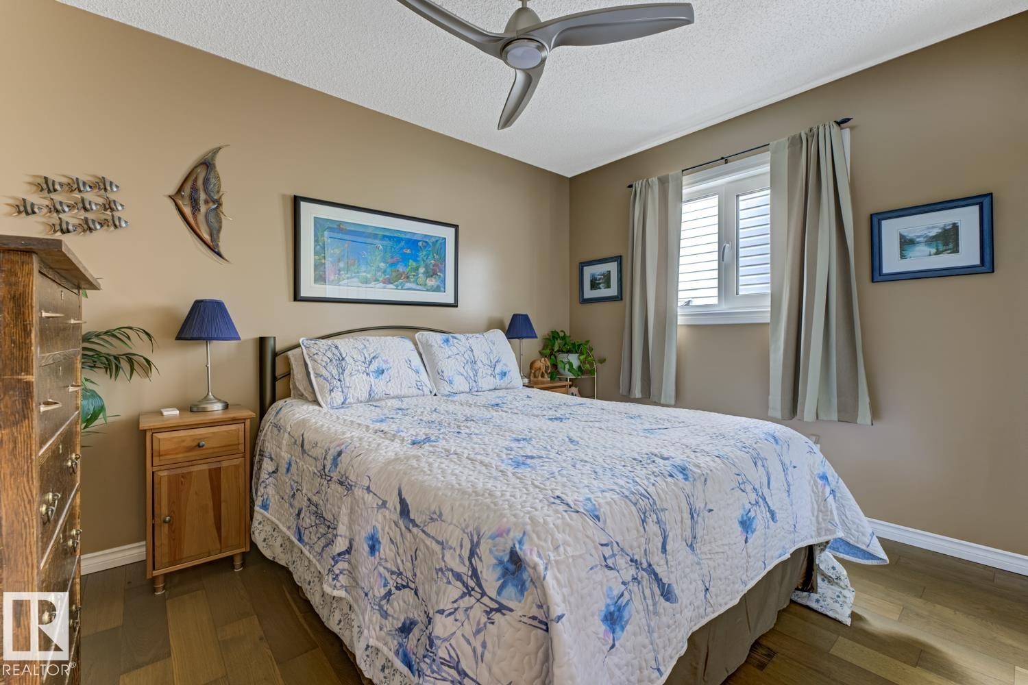 Bedroom featuring dark wood finished floors, ceiling fan, and a textured ceiling - 20148 46 Avenue, Edmonton, AB - Indoor Photo Showing Bedroom
