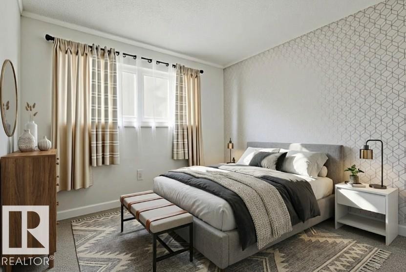 Carpeted bedroom featuring wallpapered walls and an accent wall - 13211 71 Street, Edmonton, AB - Indoor Photo Showing Bedroom