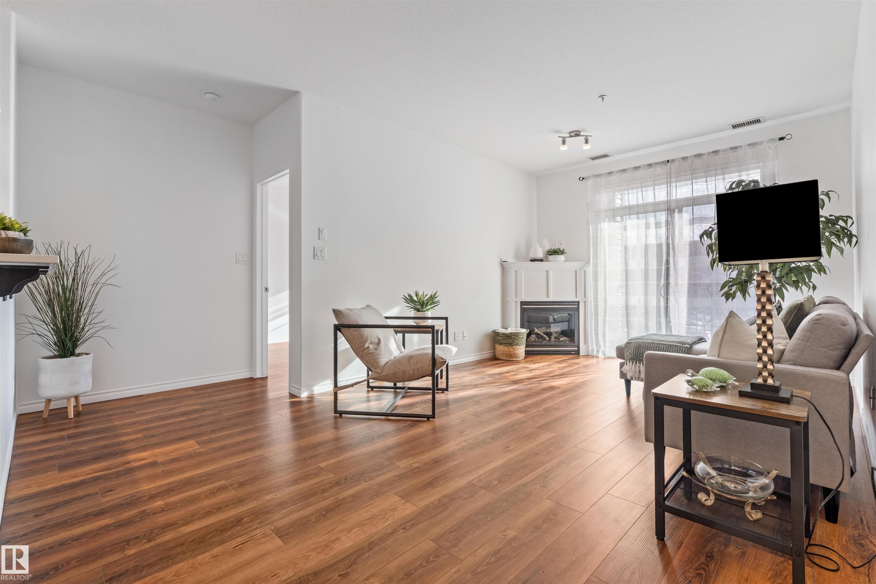 Edmonton, AB - Indoor Photo Showing Living Room With Fireplace