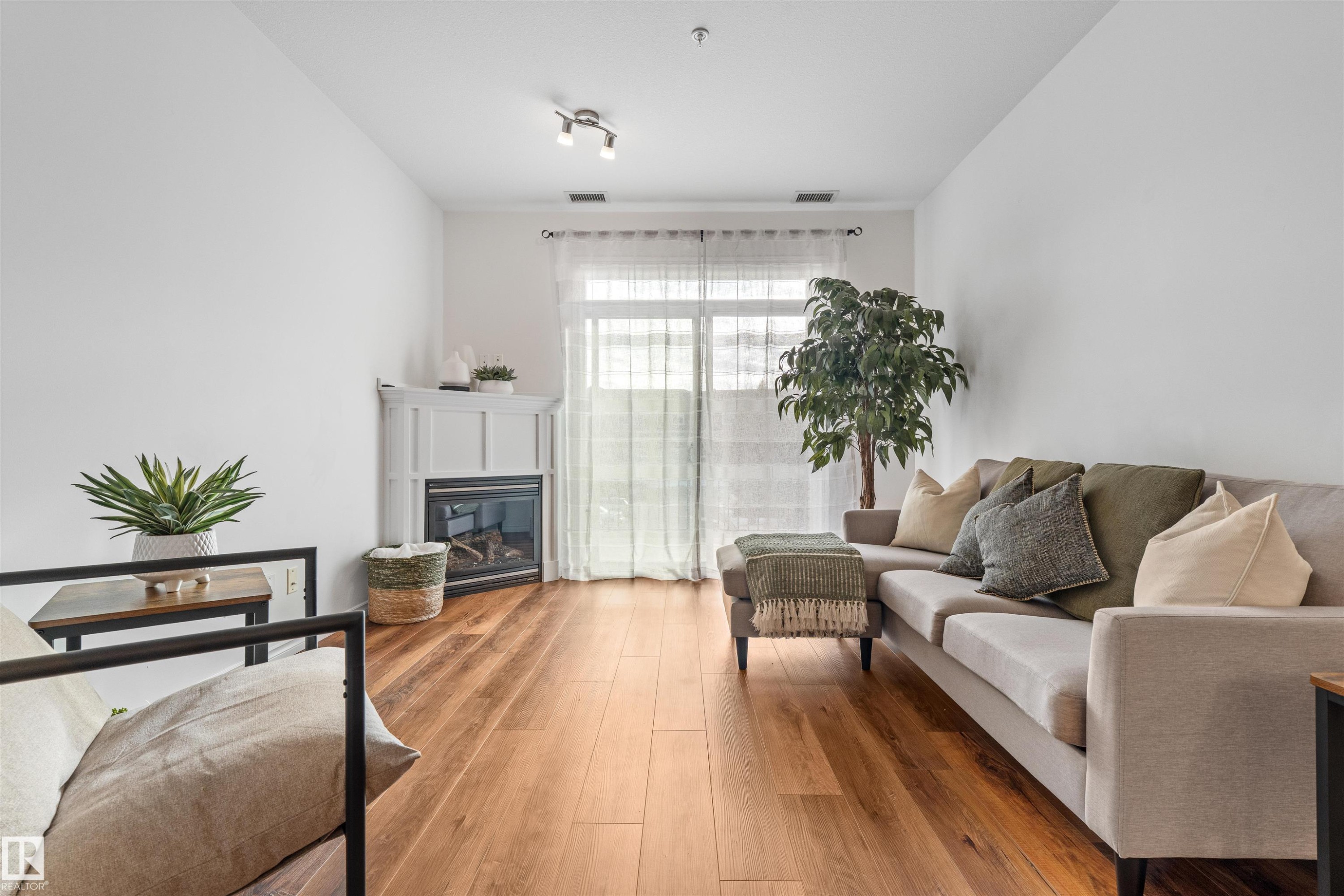 Edmonton, AB - Indoor Photo Showing Living Room With Fireplace