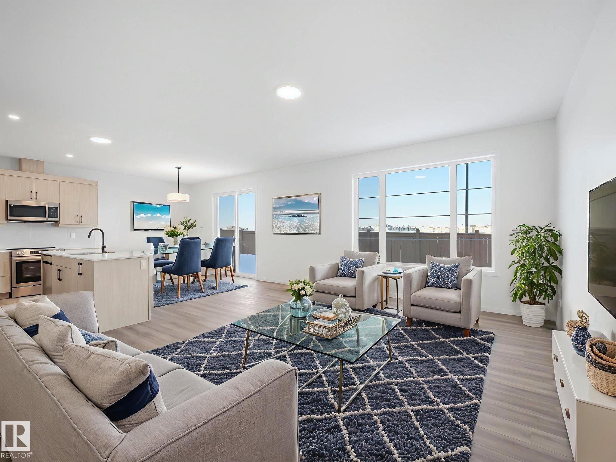 Living area featuring light wood-style floors and recessed lighting - 20506 16A Avenue, Edmonton, AB - Indoor Photo Showing Living Room With Fireplace