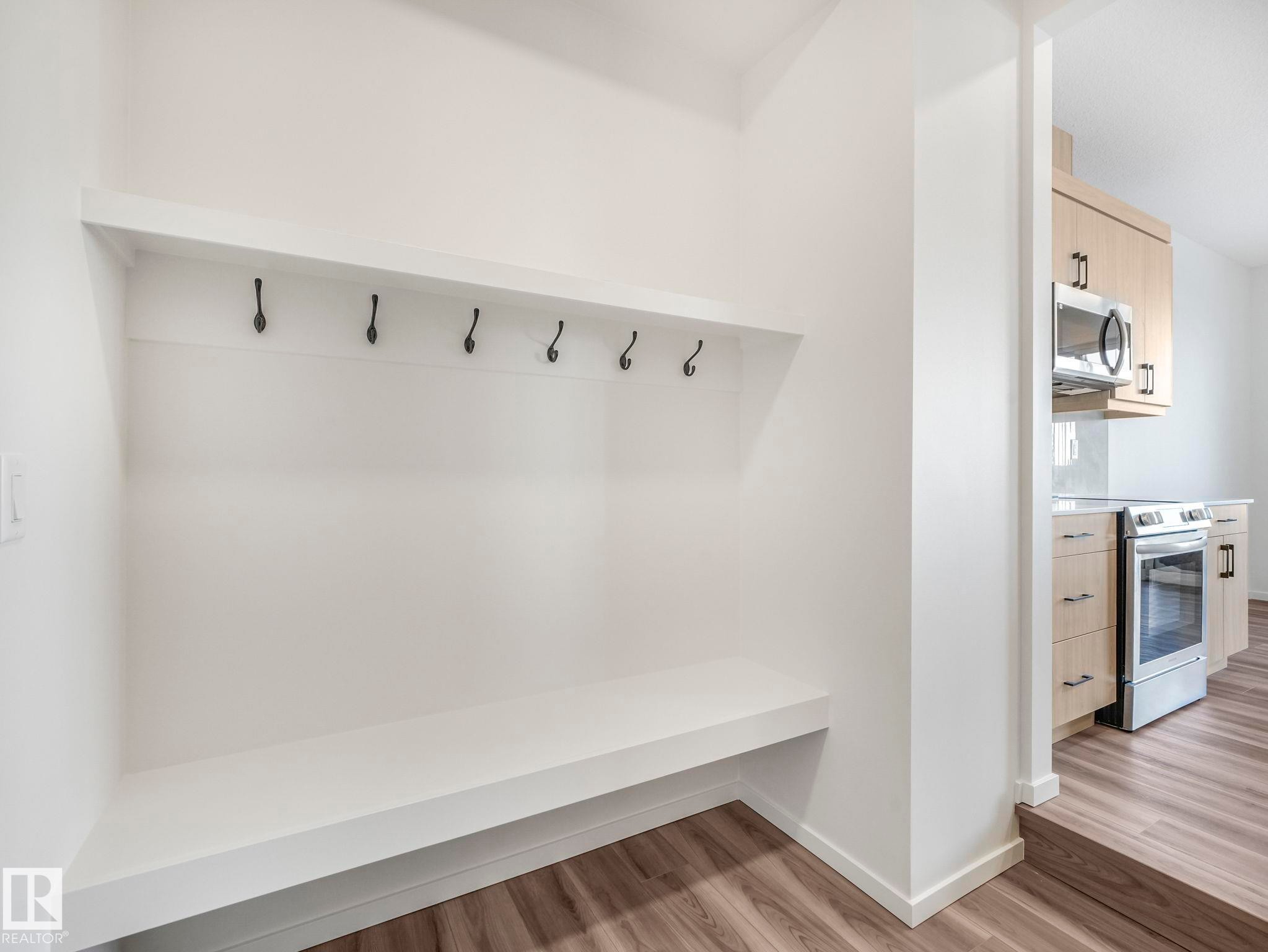 Mudroom with light wood-style flooring and baseboards - 20506 16A Avenue, Edmonton, AB - Indoor