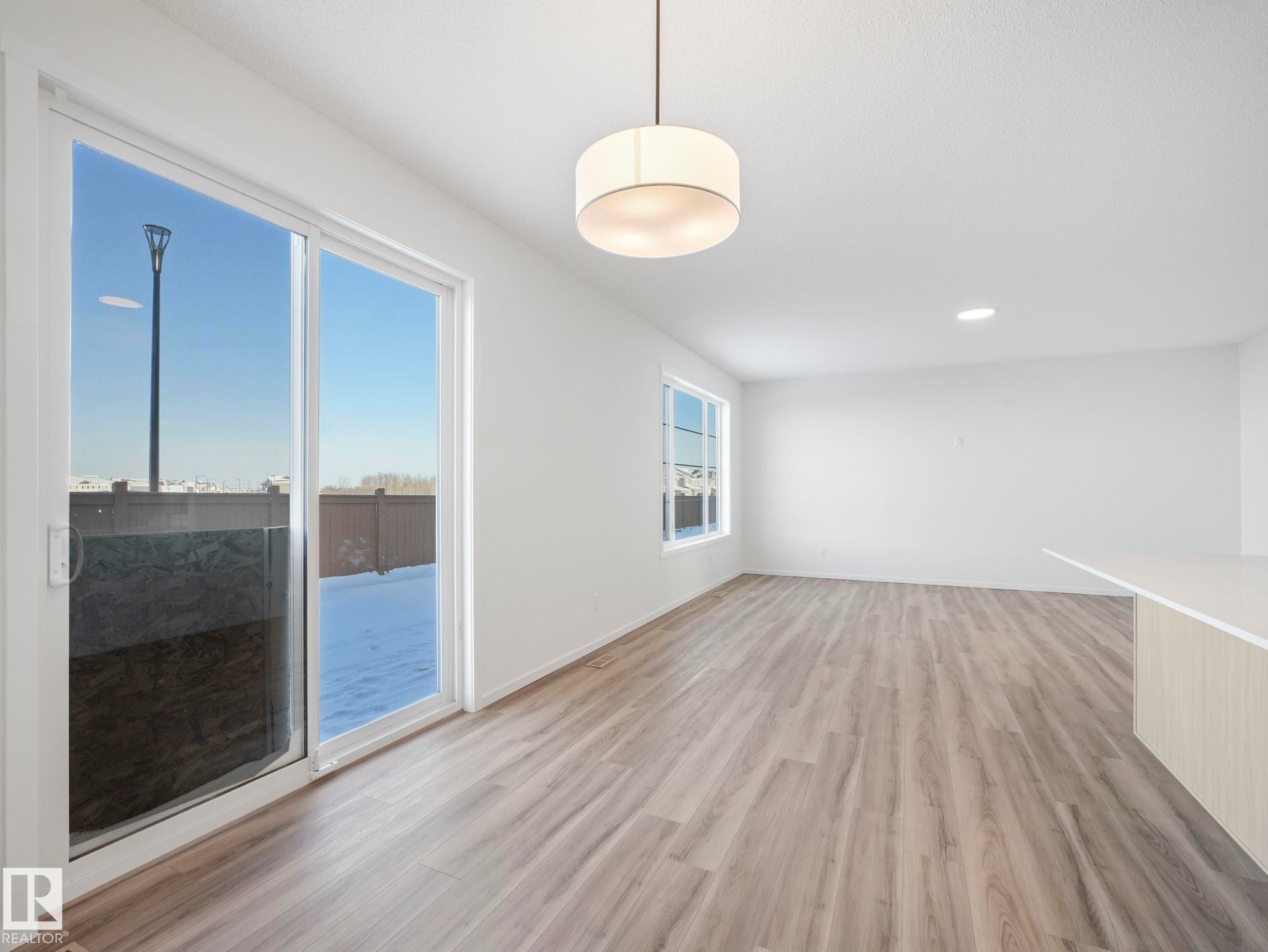 Unfurnished room with light wood-style flooring and recessed lighting - 20506 16A Avenue, Edmonton, AB - Indoor Photo Showing Other Room