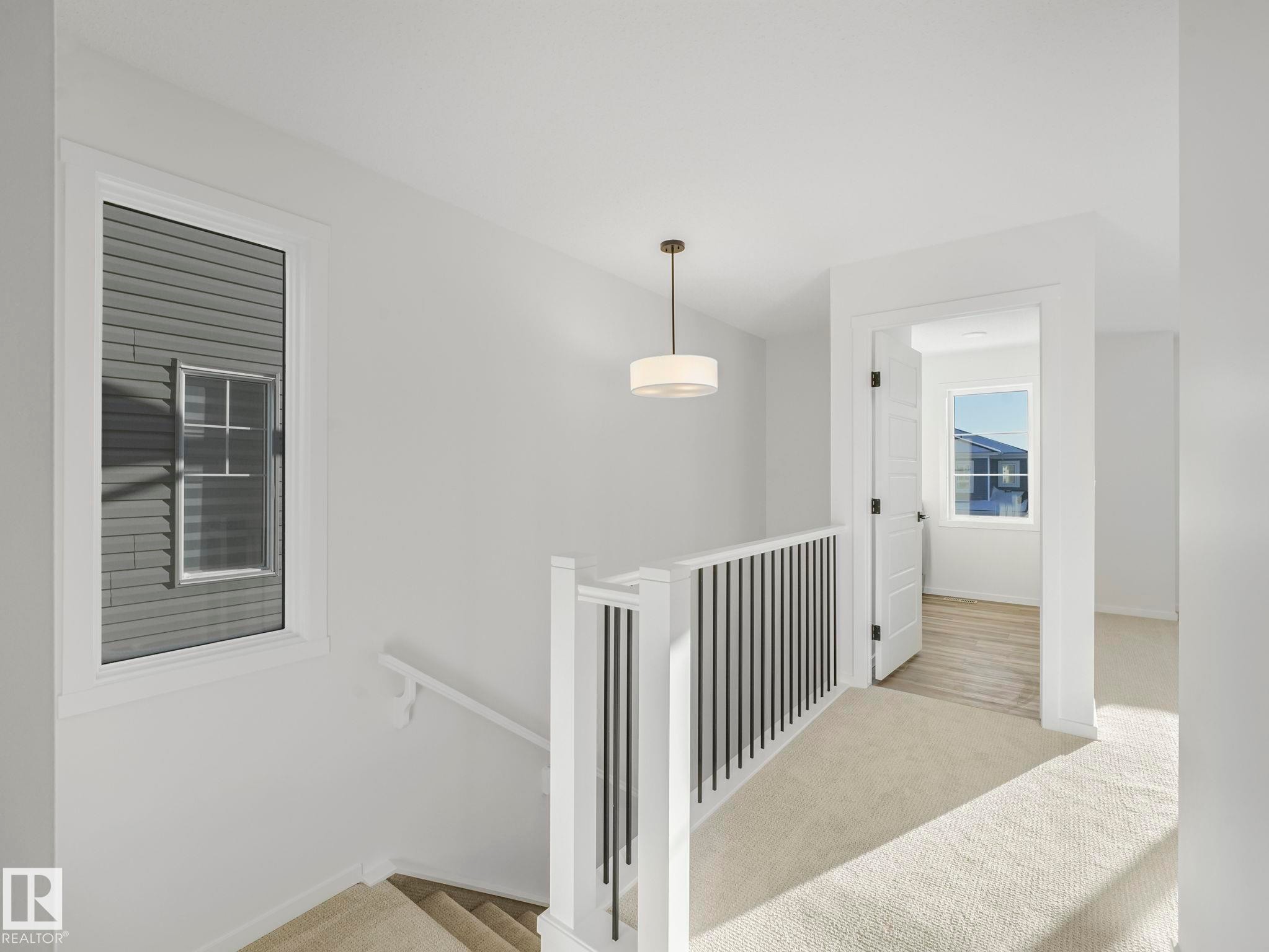 Staircase featuring carpet flooring and baseboards - 20506 16A Avenue, Edmonton, AB - Indoor Photo Showing Other Room