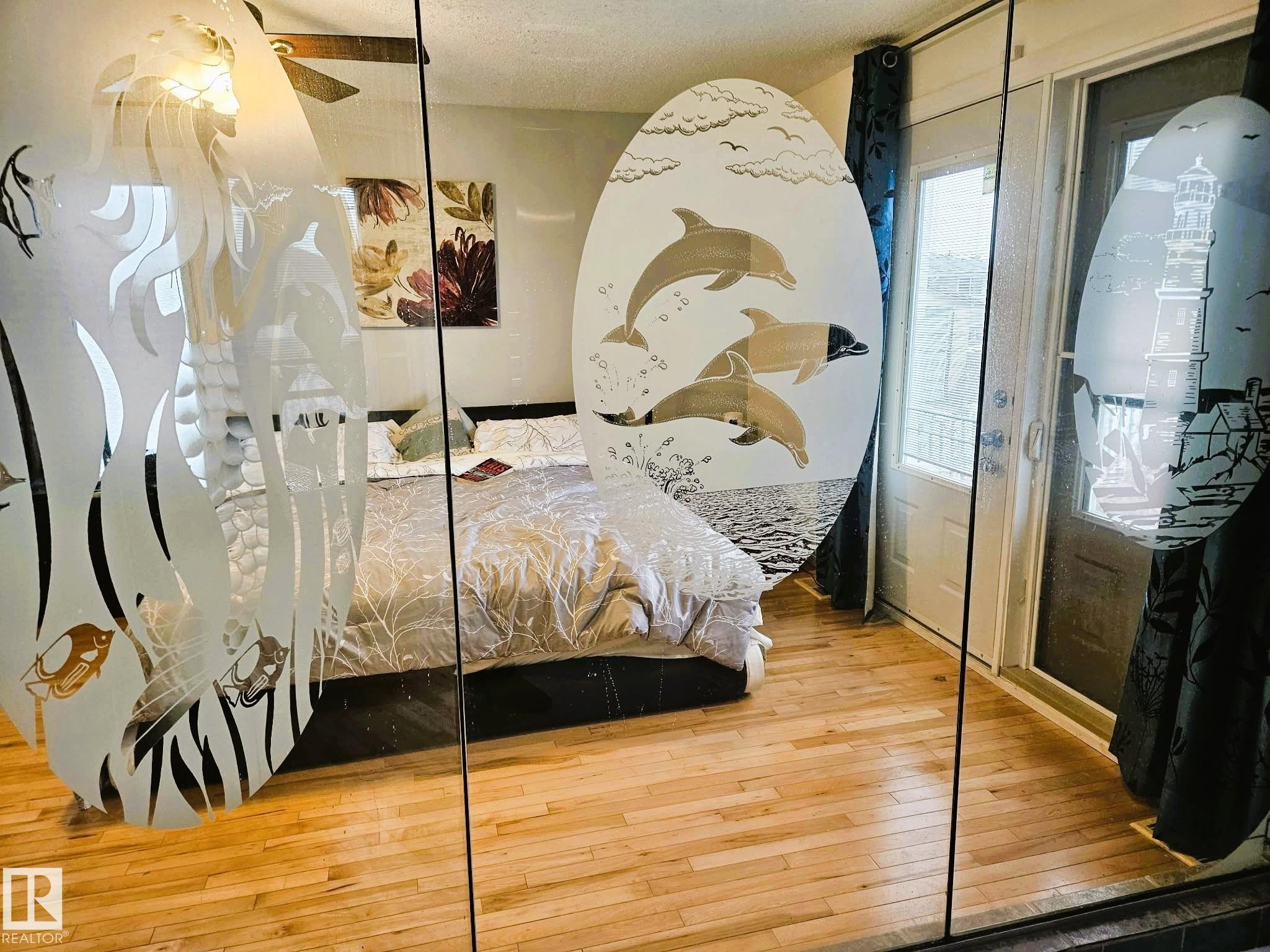 Bedroom with light wood finished floors and ceiling fan - 8512 131 Avenue, Edmonton, AB - Indoor Photo Showing Bedroom