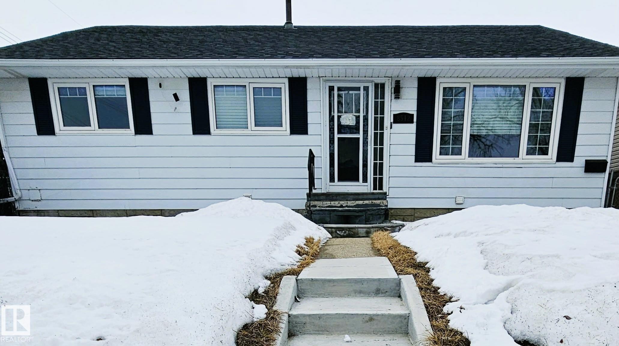View of front of property with entry steps and roof with shingles - 8512 131 Avenue, Edmonton, AB - Outdoor