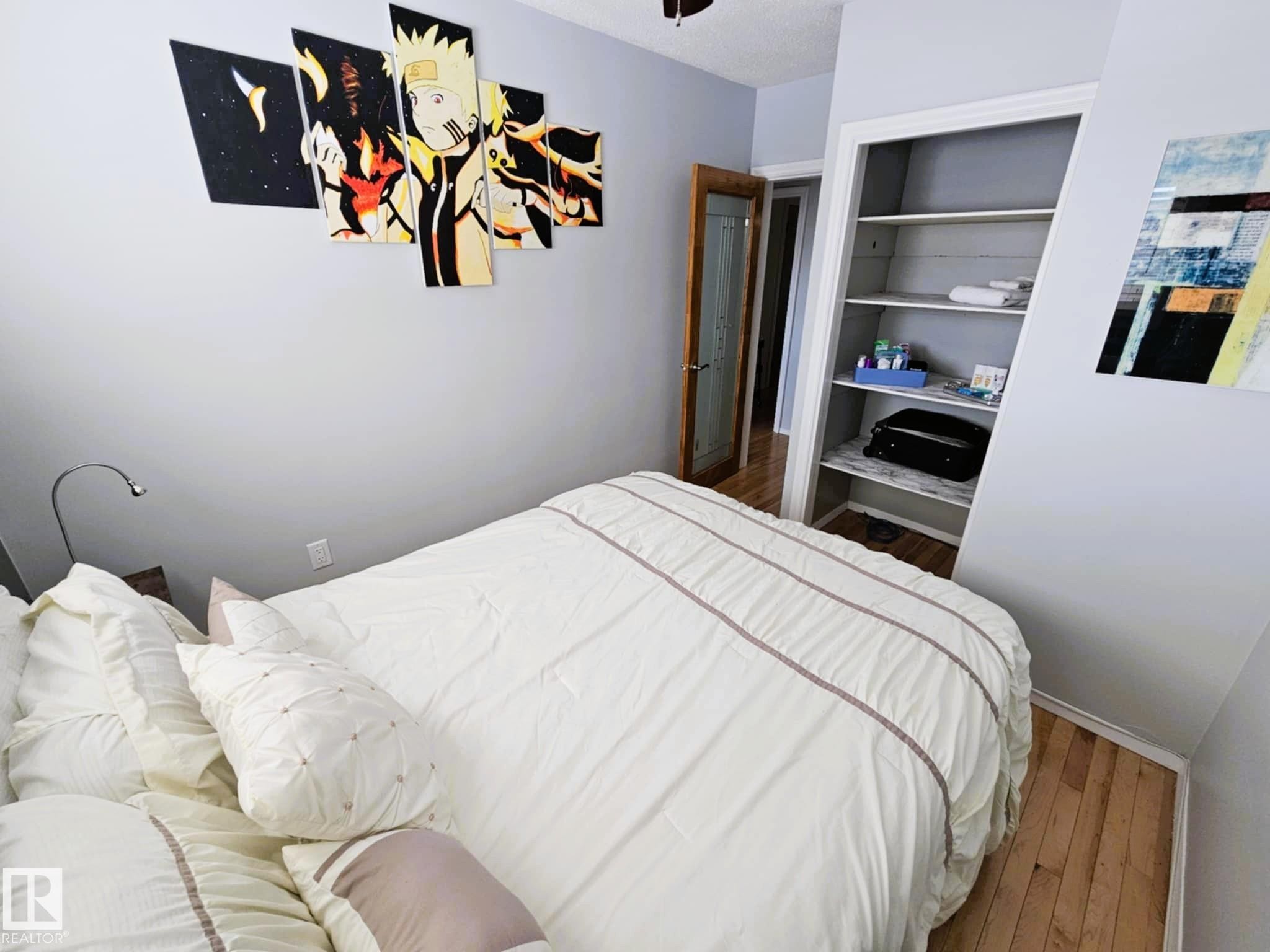 Bedroom featuring hardwood / wood-style flooring - 8512 131 Avenue, Edmonton, AB - Indoor Photo Showing Bedroom