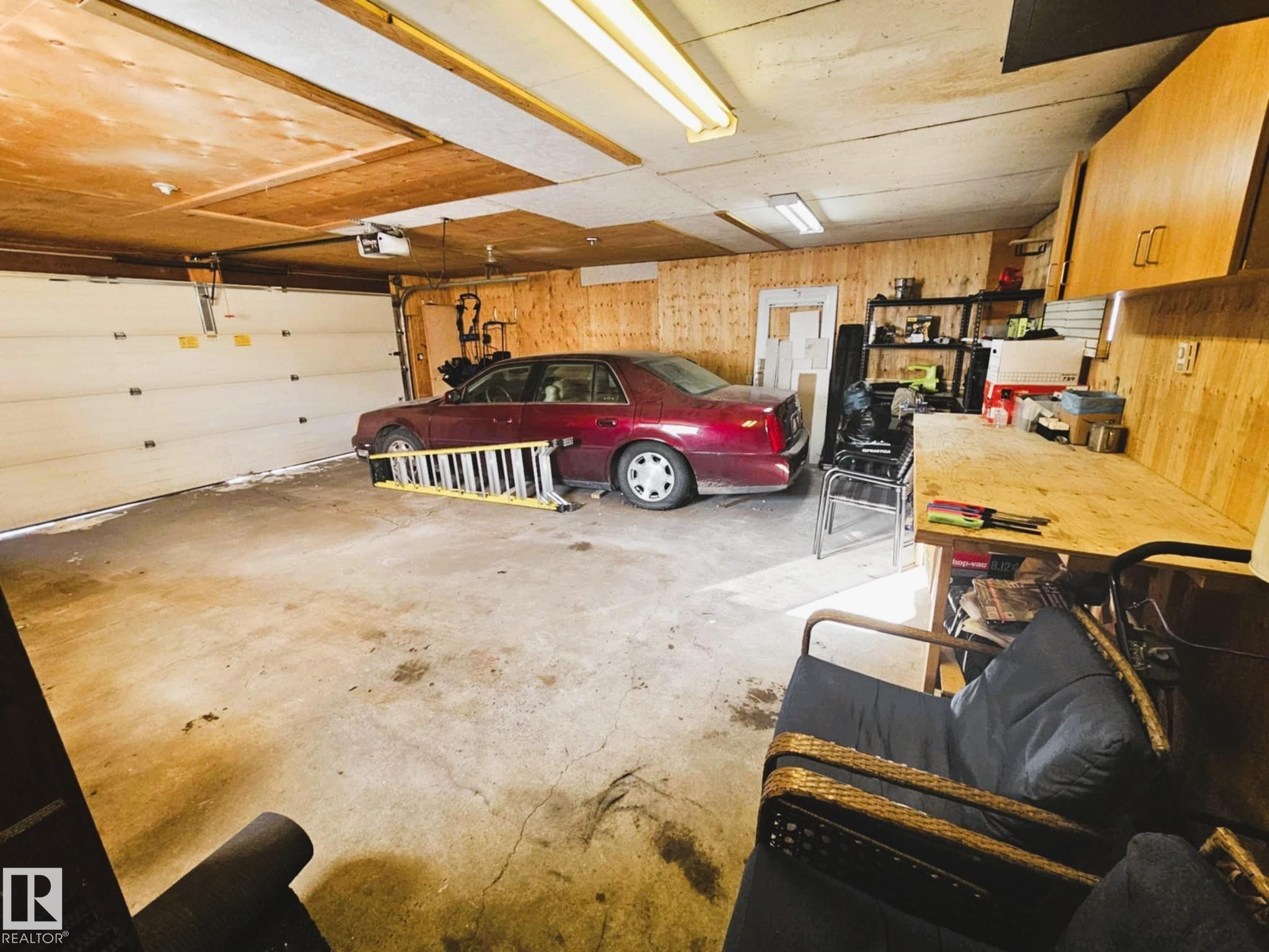 Garage featuring wooden walls - 8512 131 Avenue, Edmonton, AB - Indoor Photo Showing Garage