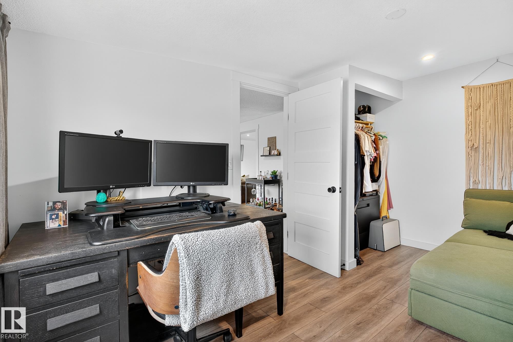 Home office with light wood-style flooring and baseboards - 23509A Twp Road 484, Rural Leduc County, AB - Indoor