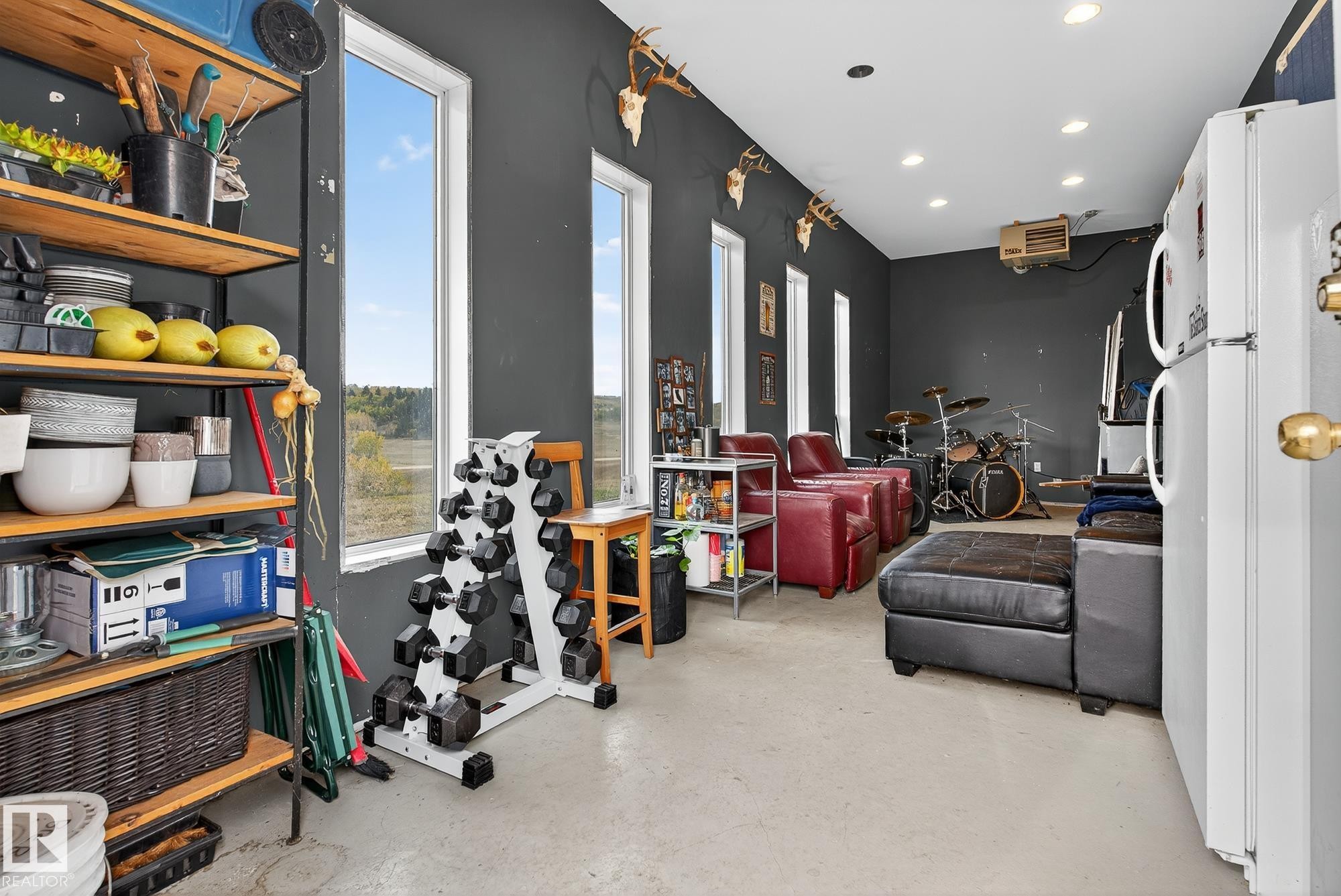 Interior space with concrete floors and a heating unit - 23509A Twp Road 484, Rural Leduc County, AB - Indoor