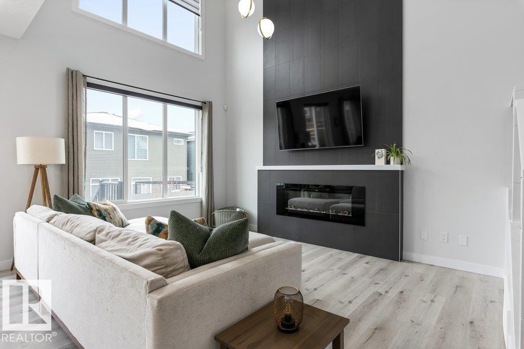 6464 King Wynd, Edmonton, AB - Indoor Photo Showing Living Room With Fireplace